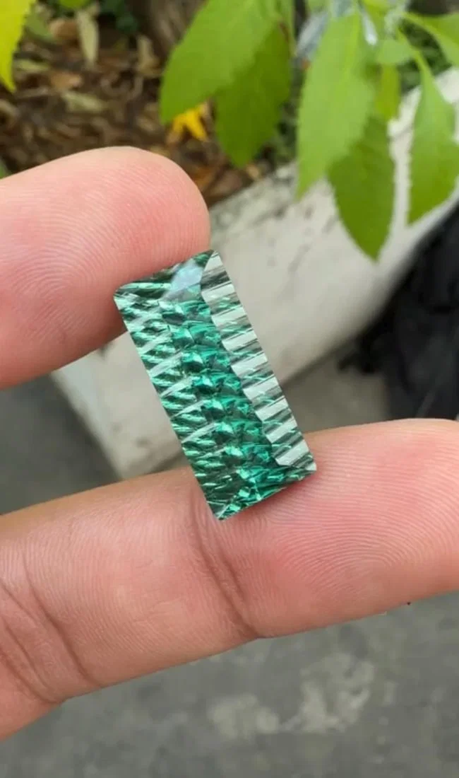 12.86 Carat Fancy Long Emerald Cut Green Tourmaline Gemstone, Waves Pattern Cut