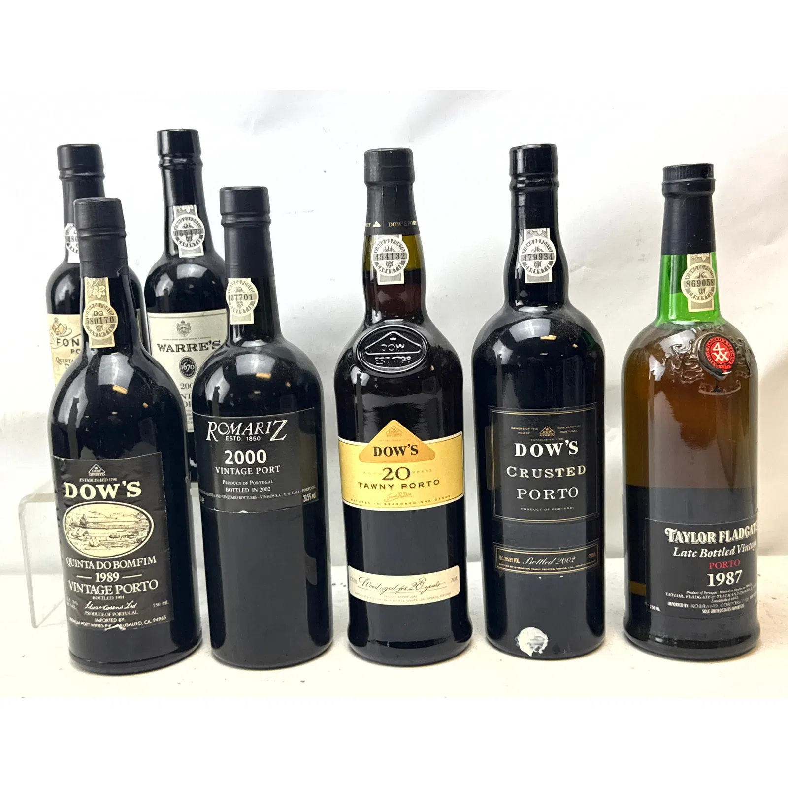 7 bottles Portuguese Port wines from several prominent producers including Dow's, Romariz, Taylor Fl