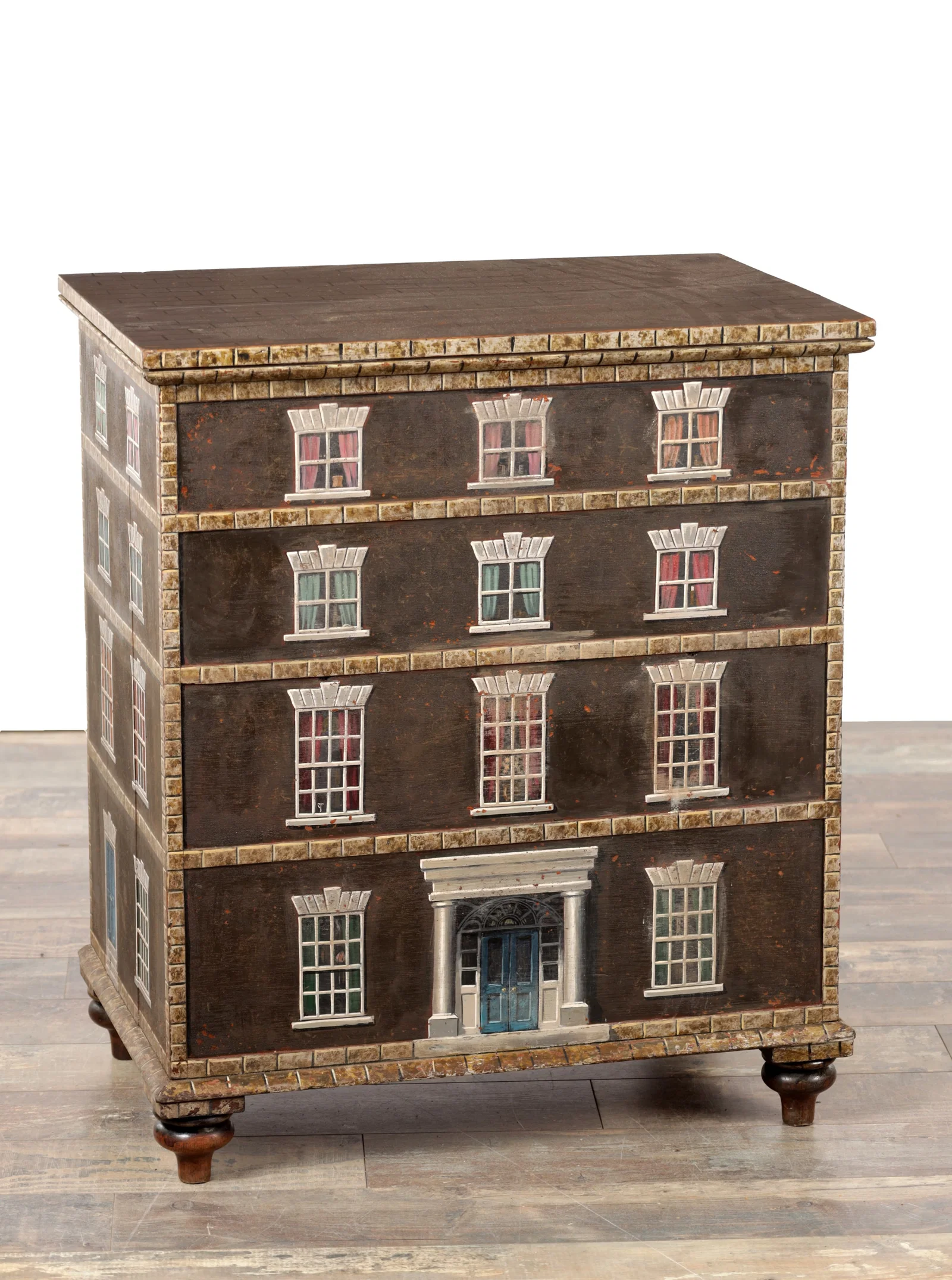 A 19TH CENTURY AND LATER PAINTED WOOD LIDDED BOX DECORATED AS A COUNTRY HOUSE