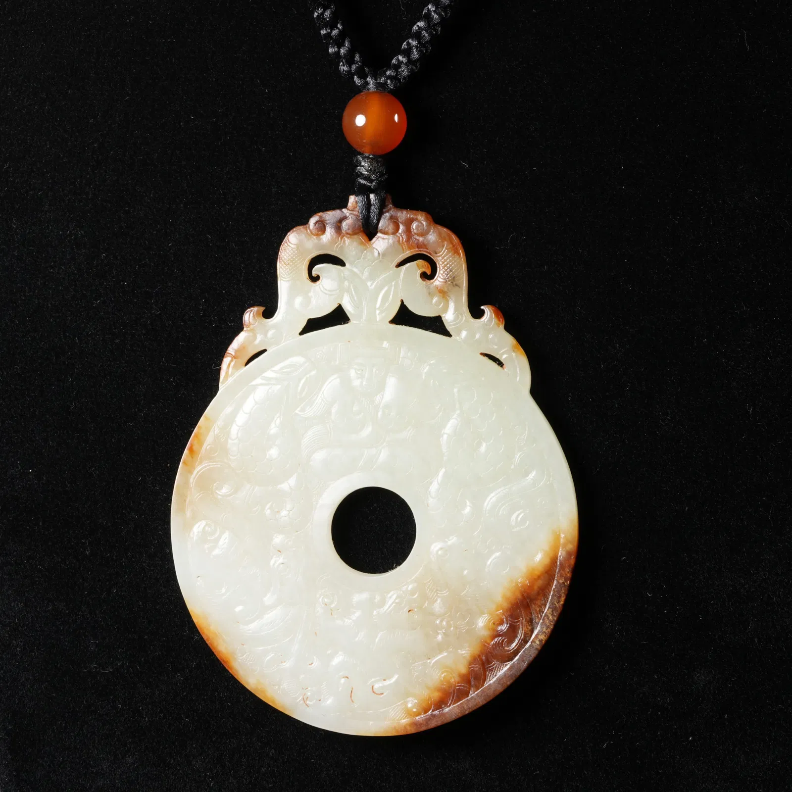 A ANCIENT JADE BI DISC WITH DRAGON MOTIF