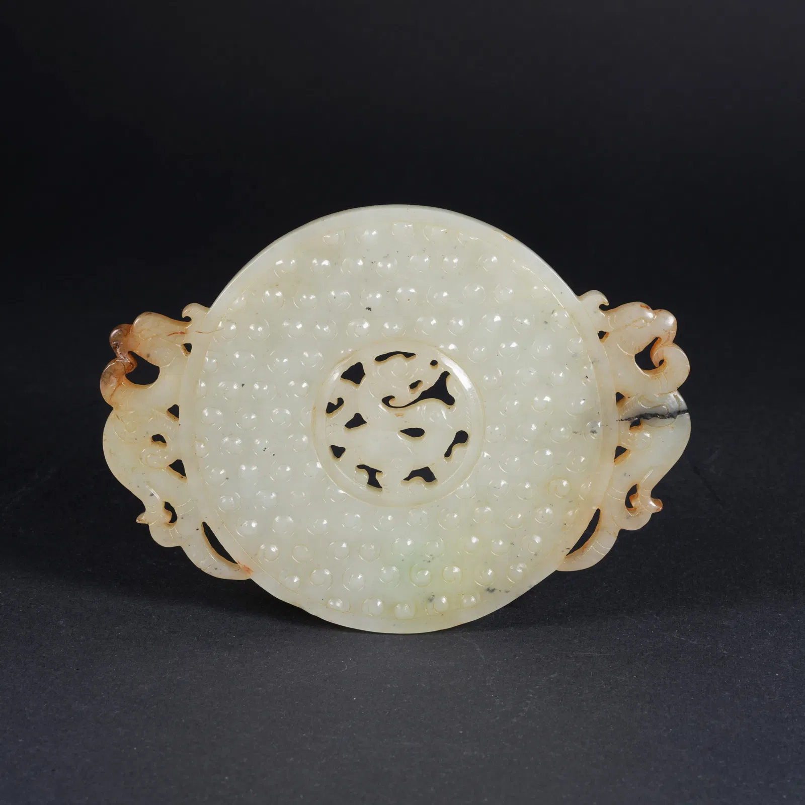 A ANCIENT JADE BI DISC WITH RAISED RIM (CHU KUO BI)