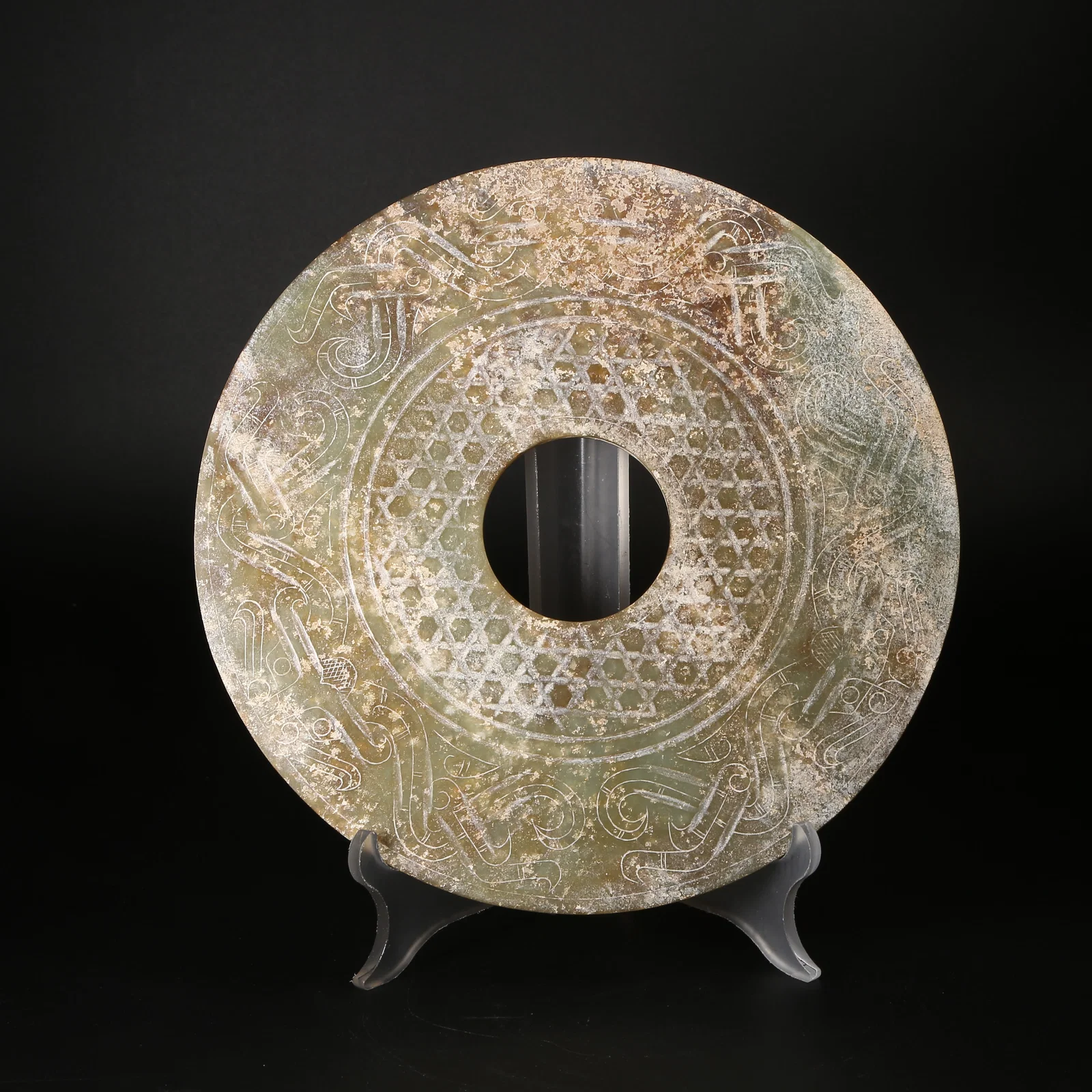 A ANCIENT JADE BI DISK WITH BEAST-FACE MOTIF