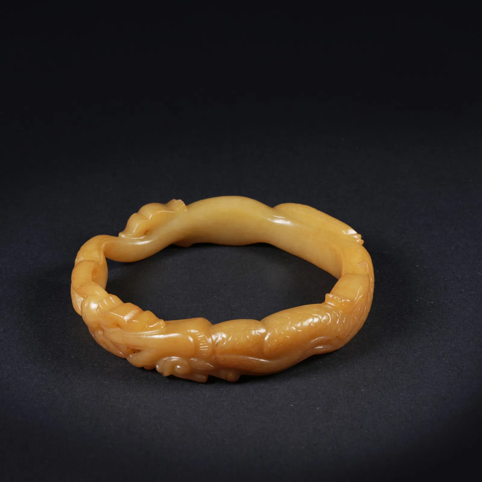 A ANCIENT JADE BRACELET WITH DRAGON MOTIF