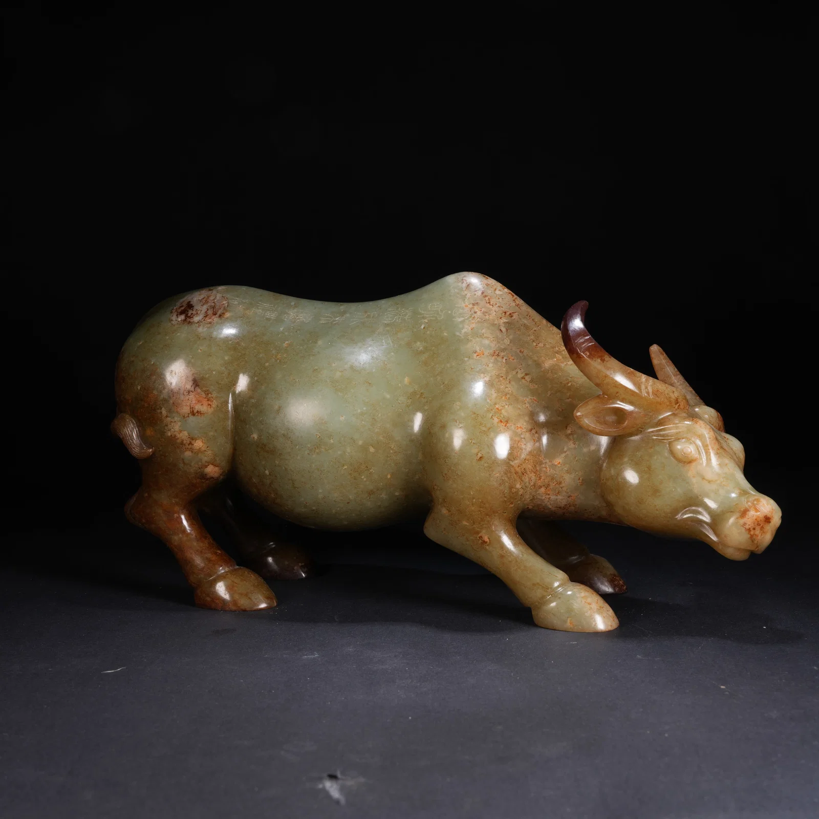 A ANCIENT JADE BULL FIGURINE