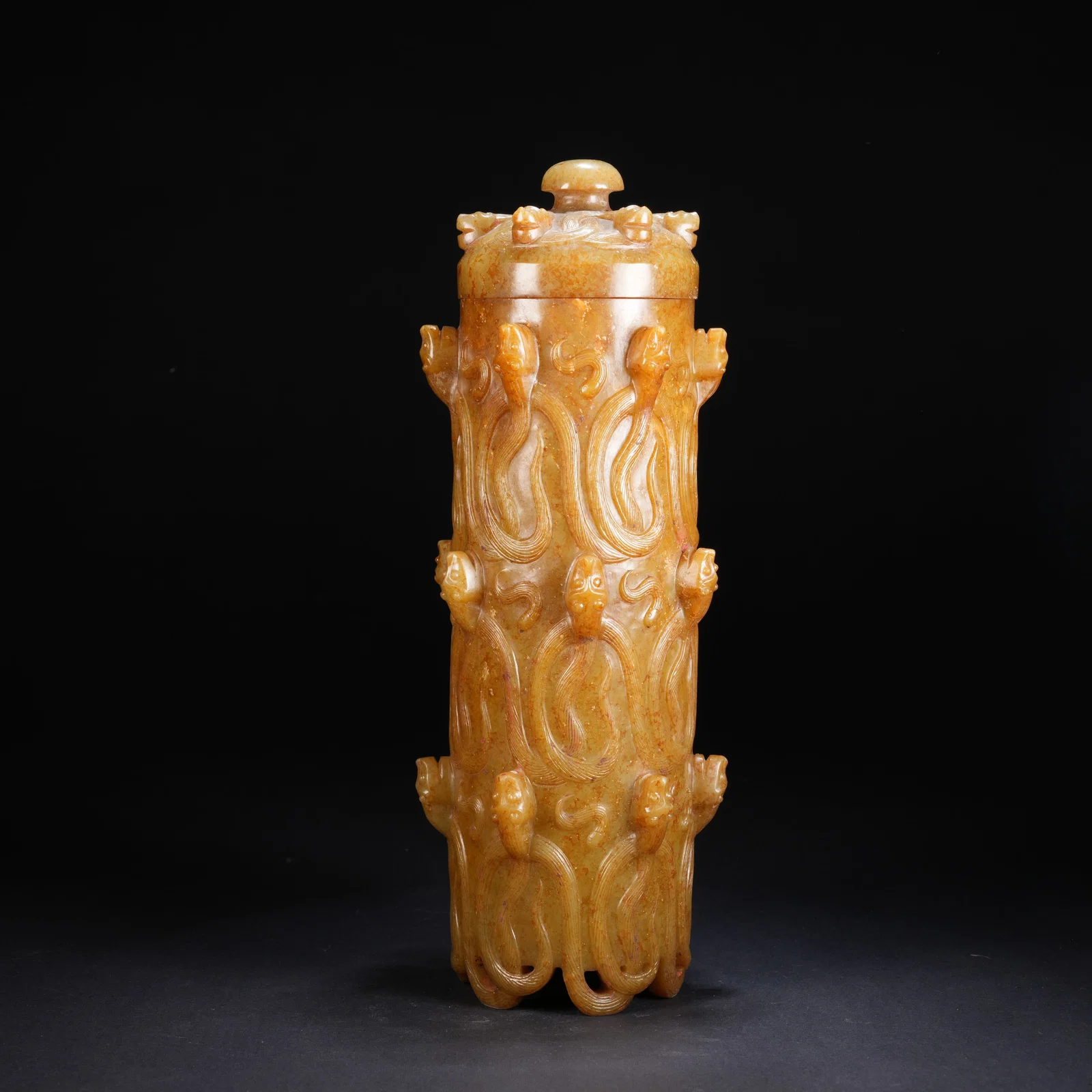 A ANCIENT JADE CIRCULAR COVERED JAR WITH DRAGON MOTIF