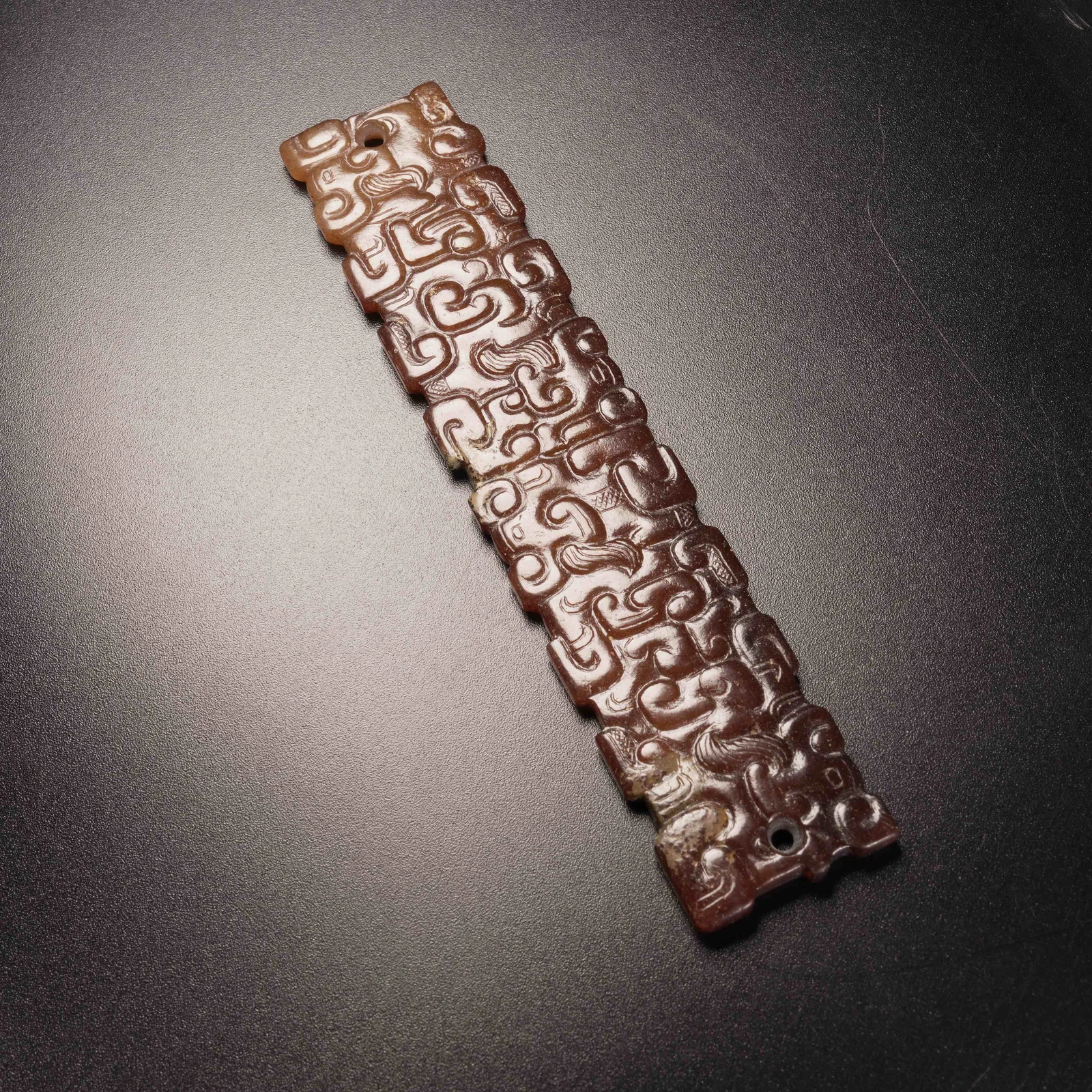 A ANCIENT JADE PENDANT WITH CLOUD-HOOK MOTIF