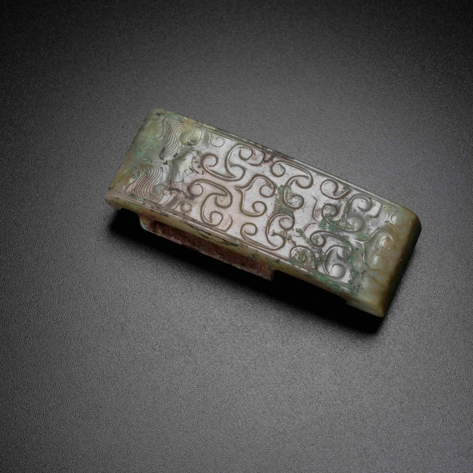 A ARCHAIC JADE ANIMAL MASK–PATTERN SWORD FITTINGS