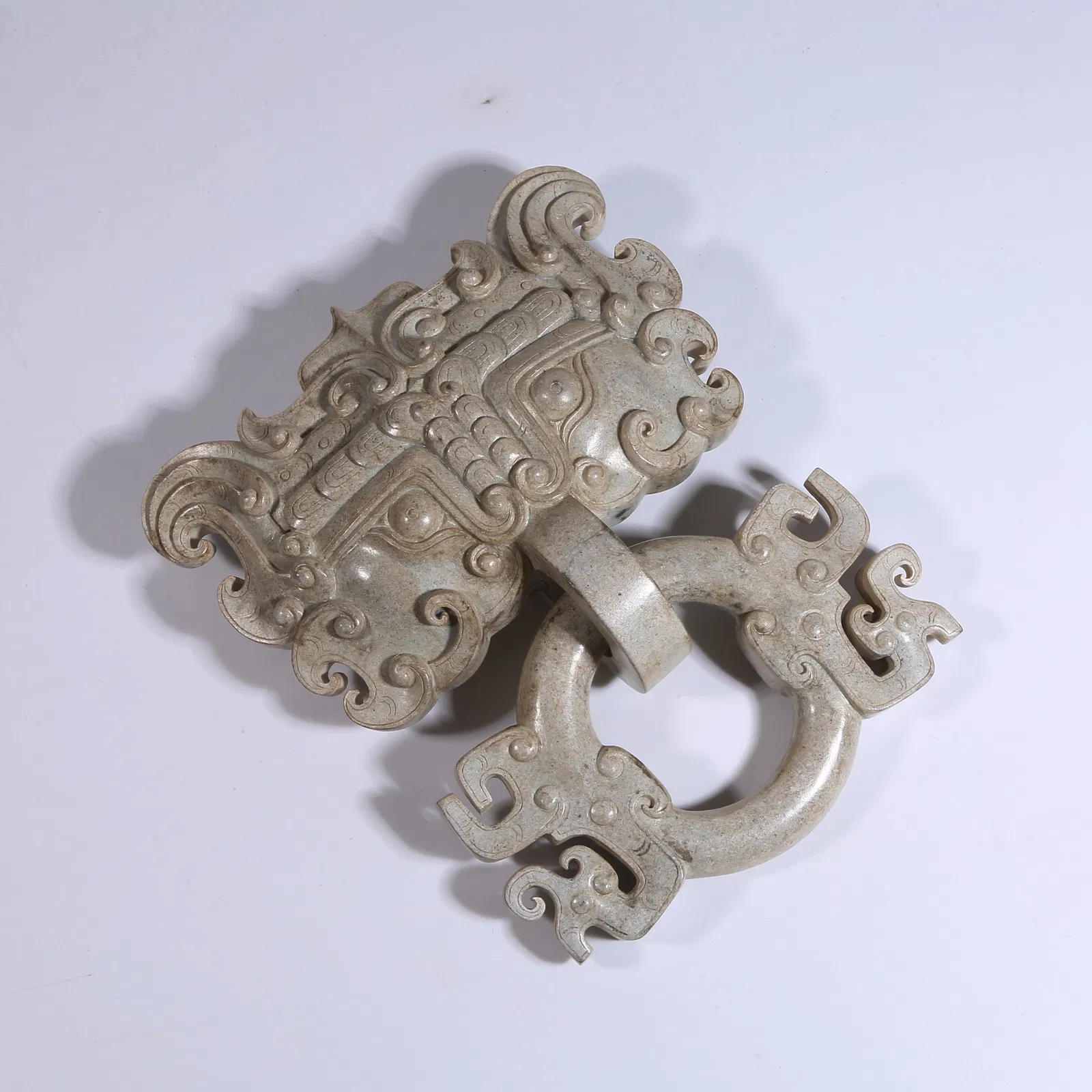 A ARCHAIC JADE BEAST-FACE MOTIF SCEPTER HEAD