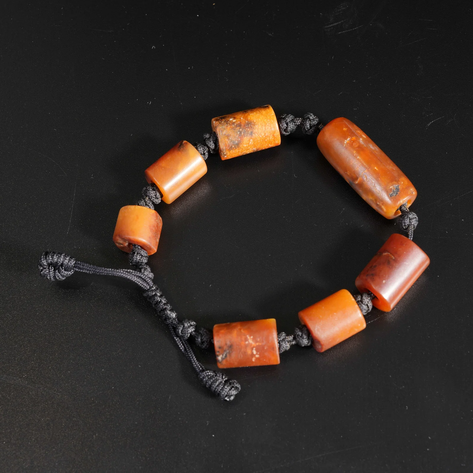 A ARCHAIC JADE CARVED BEAD BRACELET