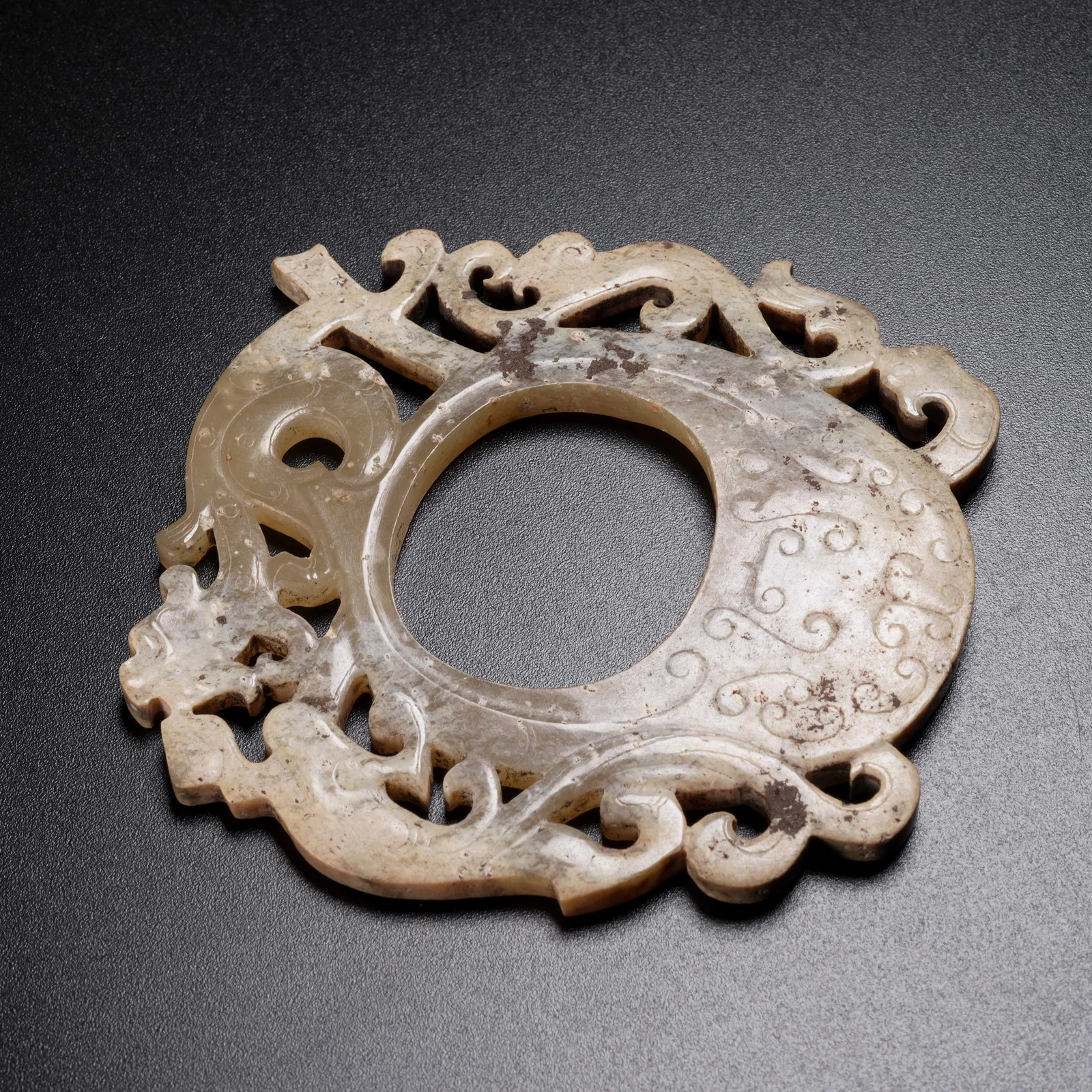 A ARCHAIC JADE CHILONG-PATTERN "CHICKEN-HEART" PENDANT