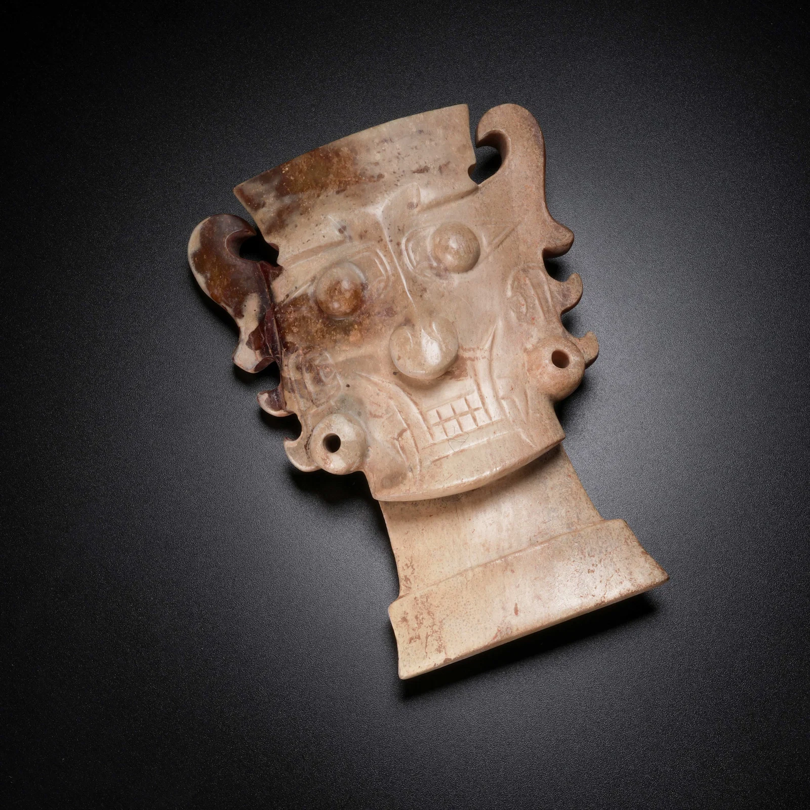 A ARCHAIC JADE DIVINE FACE PENDANT
