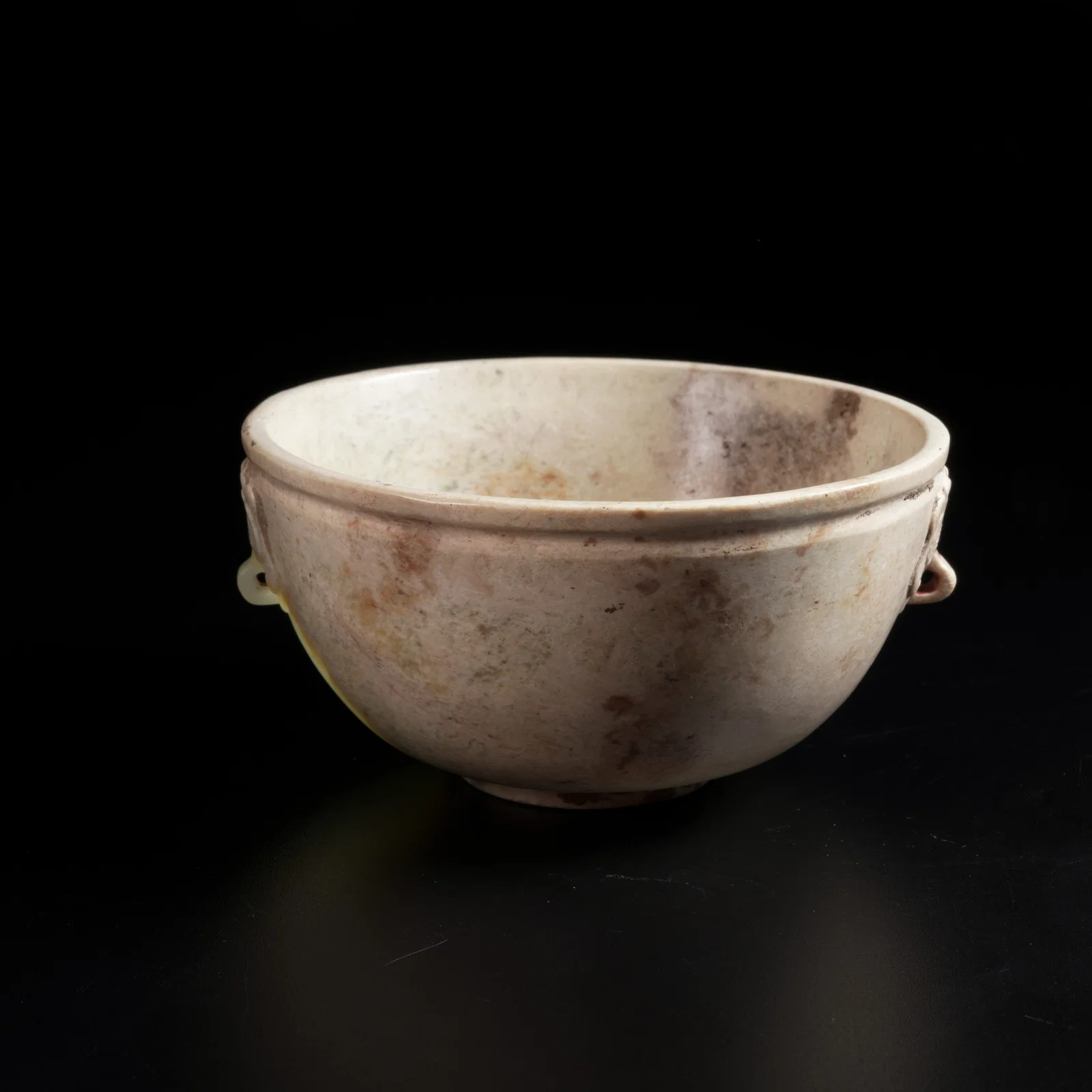 A ARCHAIC JADE DOUBLE-HANDLED ANIMAL-EAR BOWL