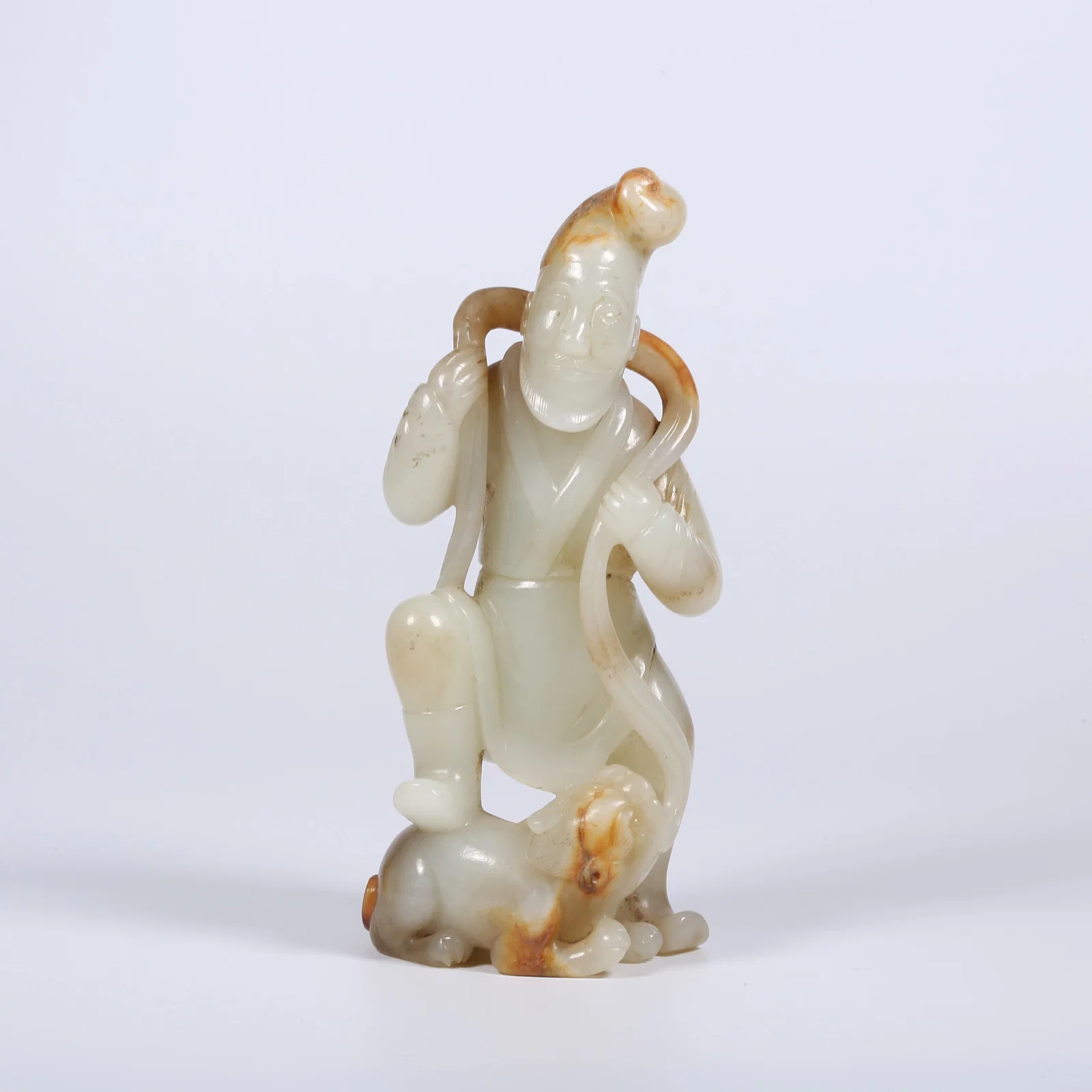 A ARCHAIC JADE HU (CENTRAL ASIAN) PLAYING WITH LION FIGURINE