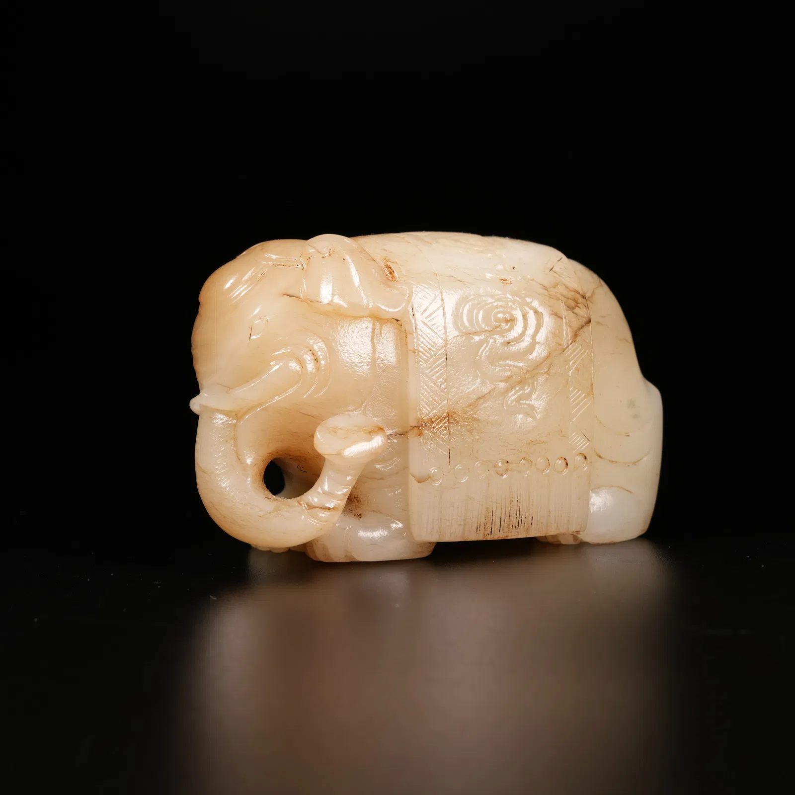 A ARCHAIC JADE "PEACE AND PROSPERITY" ELEPHANT ORNAMENT