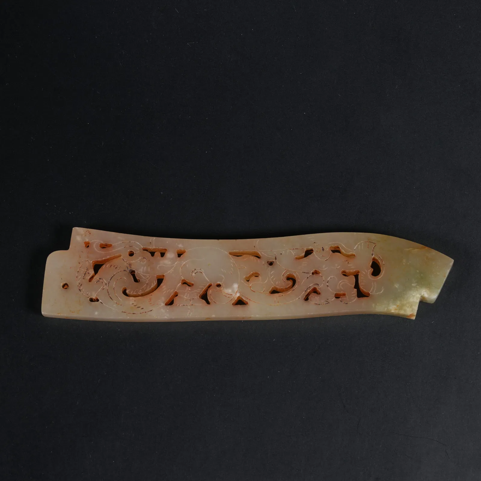 A ARCHAIC JADE PENDANT WITH AUSPICIOUS BEAST MOTIF