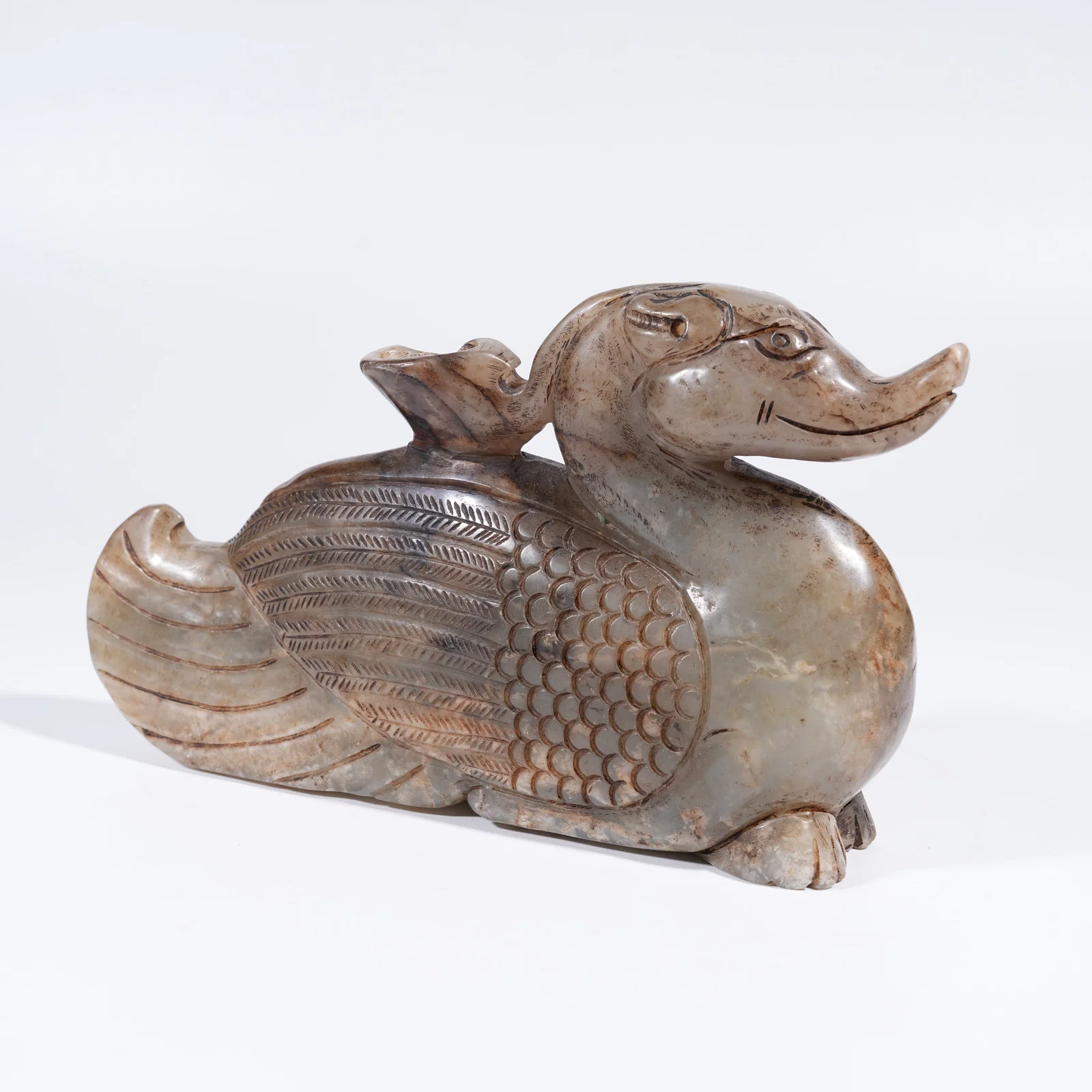 A ARCHAIC JADE PHOENIX ORNAMENT