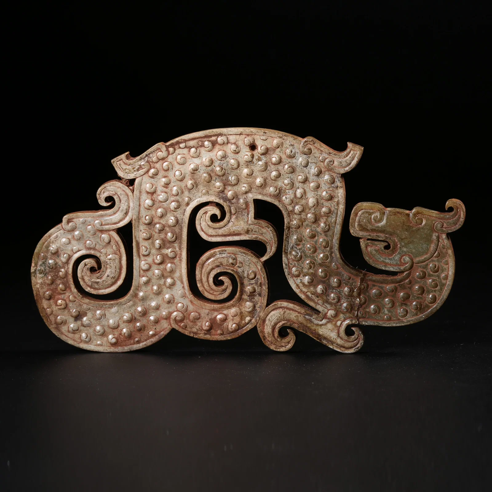 A ARCHAIC JADE S-SHAPED DRAGON PENDANT