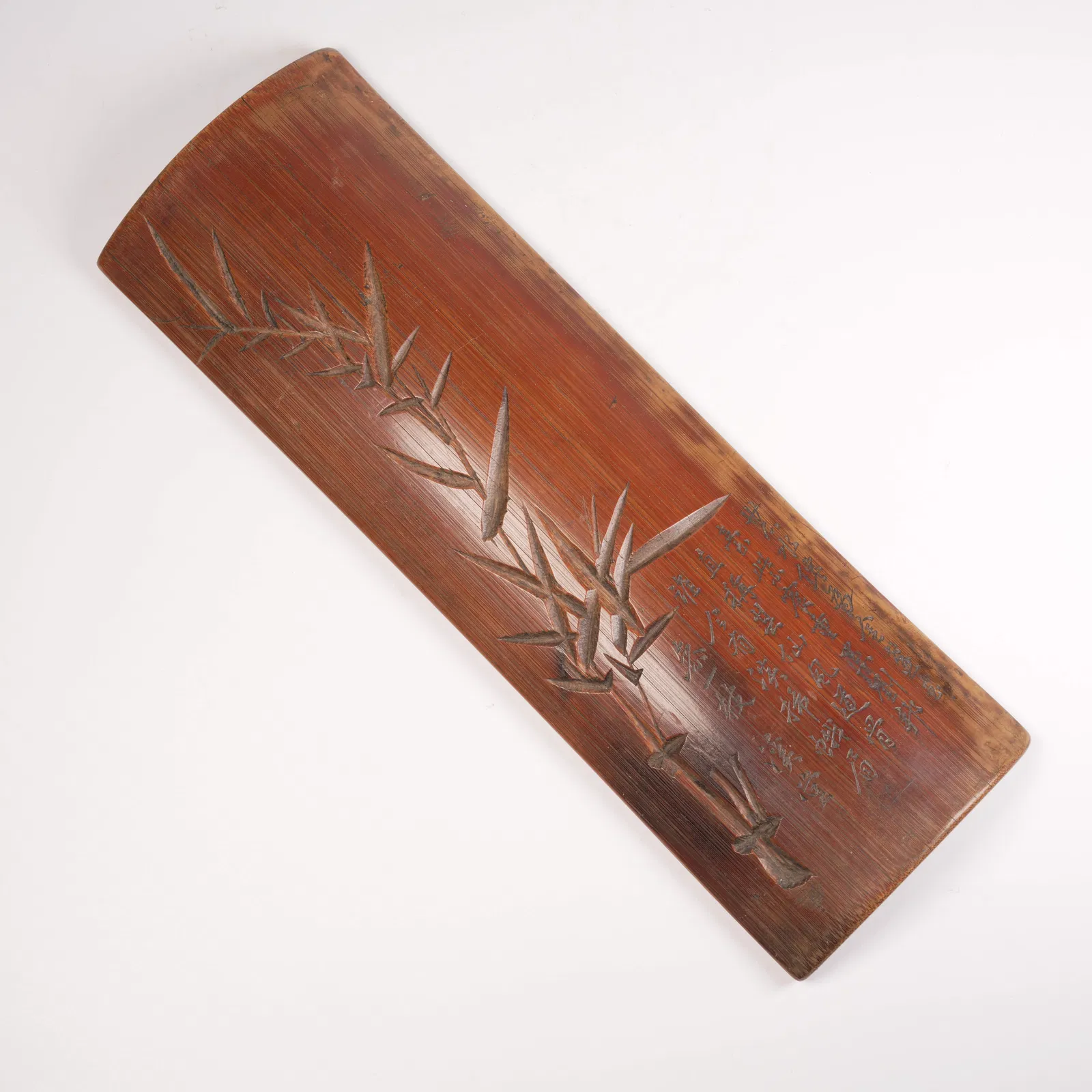 A BAMBOO-CARVED ARMREST WITH BAMBOO-LEAF MOTIF