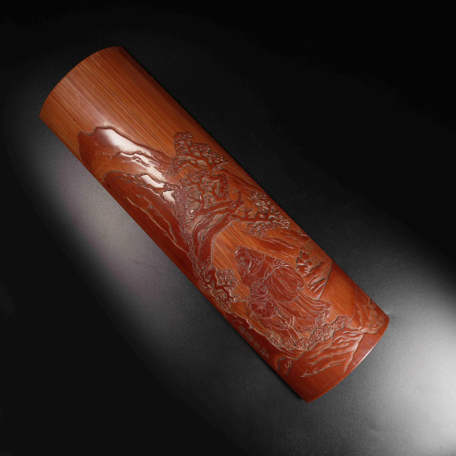 A BAMBOO-CARVED ARMREST WITH SCHOLAR UNDER PINE MOTIF