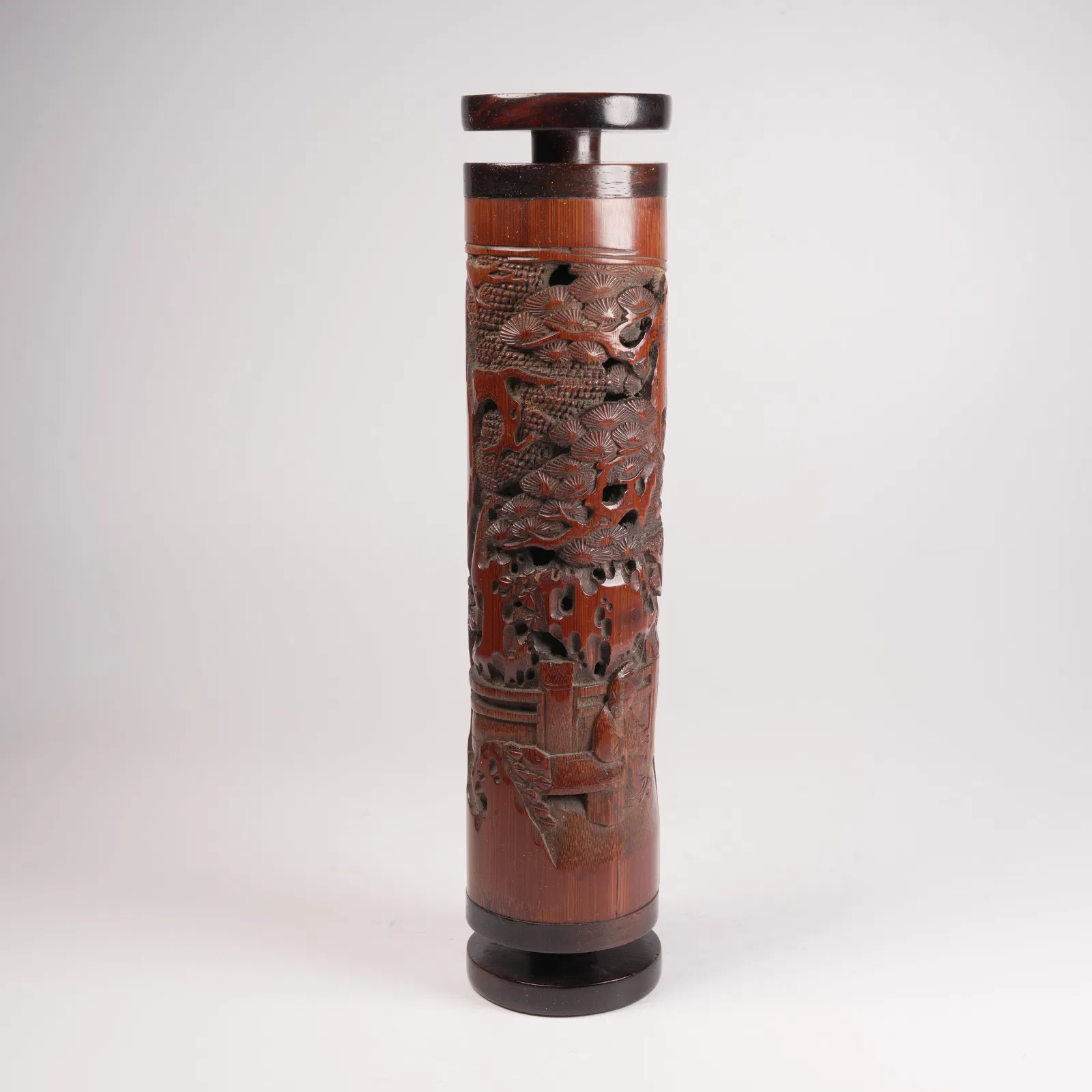 A BAMBOO-CARVED INCENSE CONTAINER WITH SCHOLAR UNDER PINE MOTIF