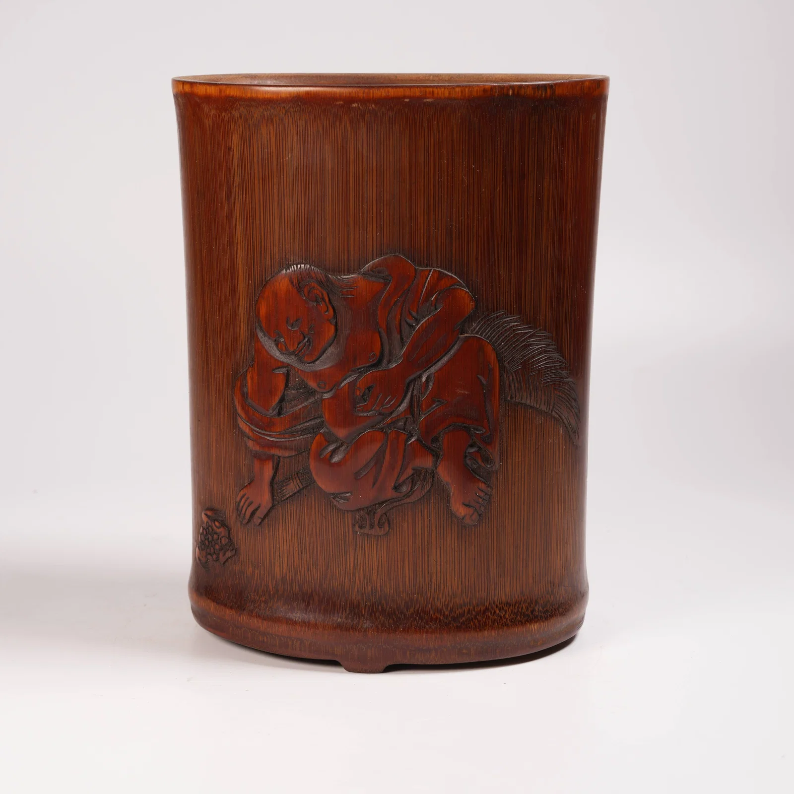 A BAMBOO CARVING "LIU HAI PLAYING WITH GOLDEN TOAD" BRUSH POT