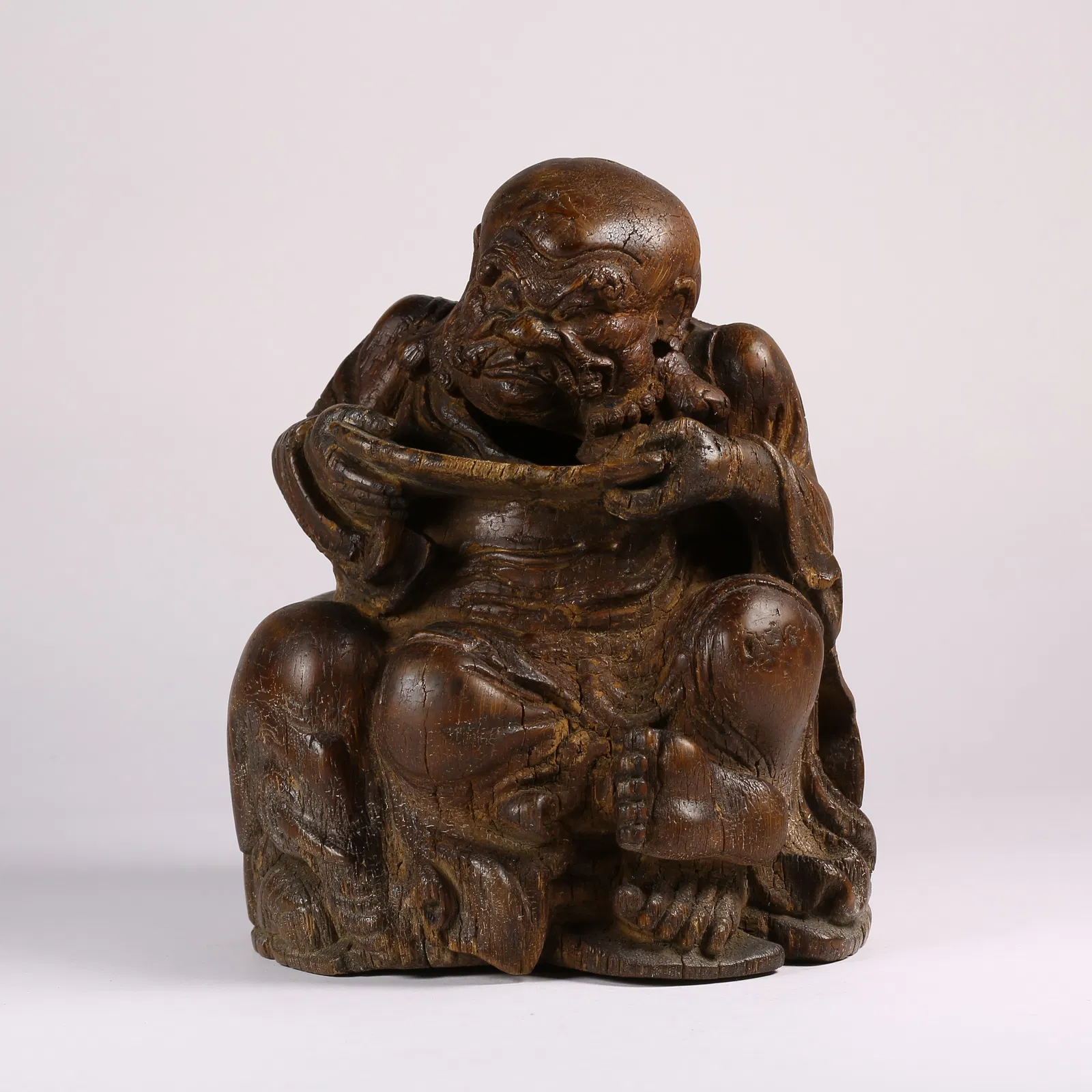 A BAMBOO ROOT CARVED ARHAT FIGURINE