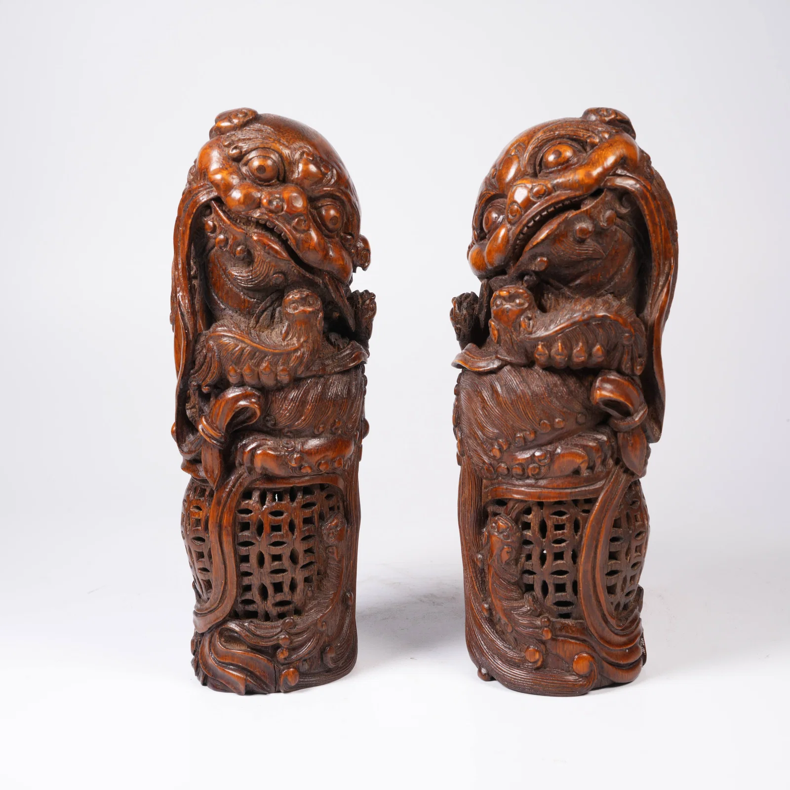 A BAMBOO-ROOT CARVED MYTHICAL-LION ORNAMENT SET
