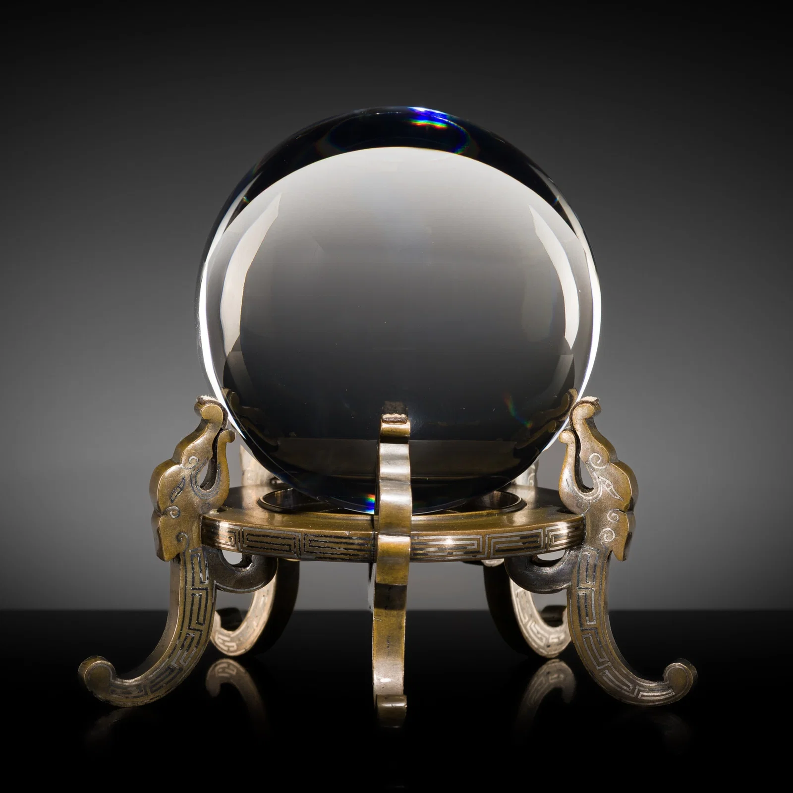 A BARIUM LEAD GLASS SPHERE WITH A SILVER-INLAID 'FIVE CHILONG' BRONZE STAND, 17TH-18TH CENTURY