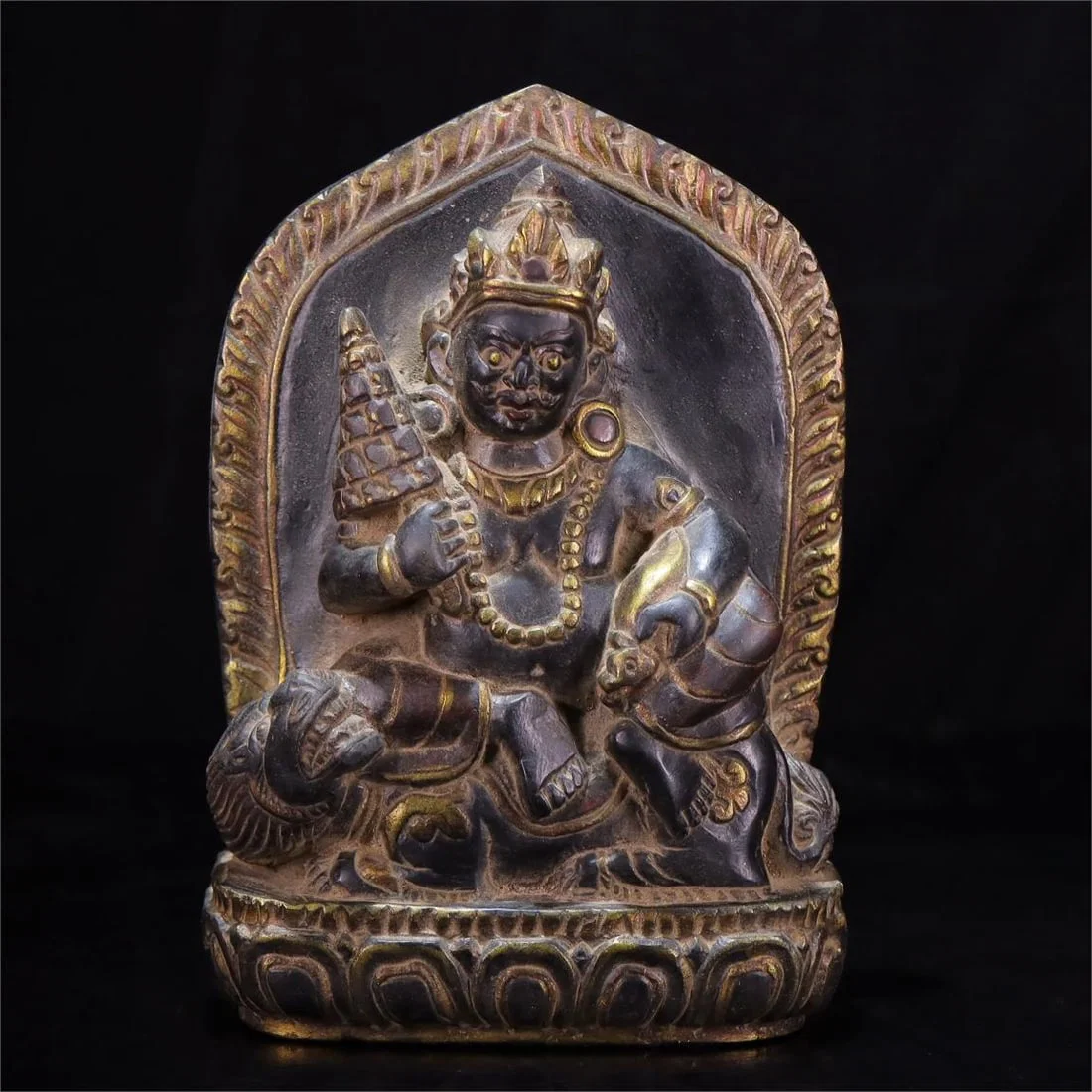 A beautiful black stone carved treasure king