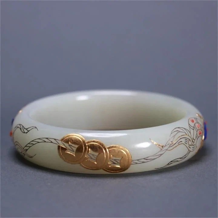 A beautiful Hetian jade inlaid gold and silver wire bracelet