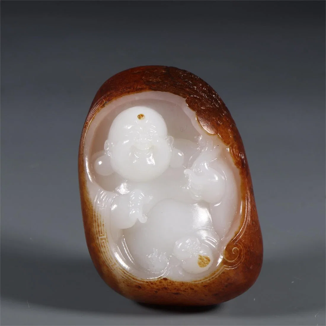 A beautiful Maitreya Buddha carving piece made of Hetian jade seed material