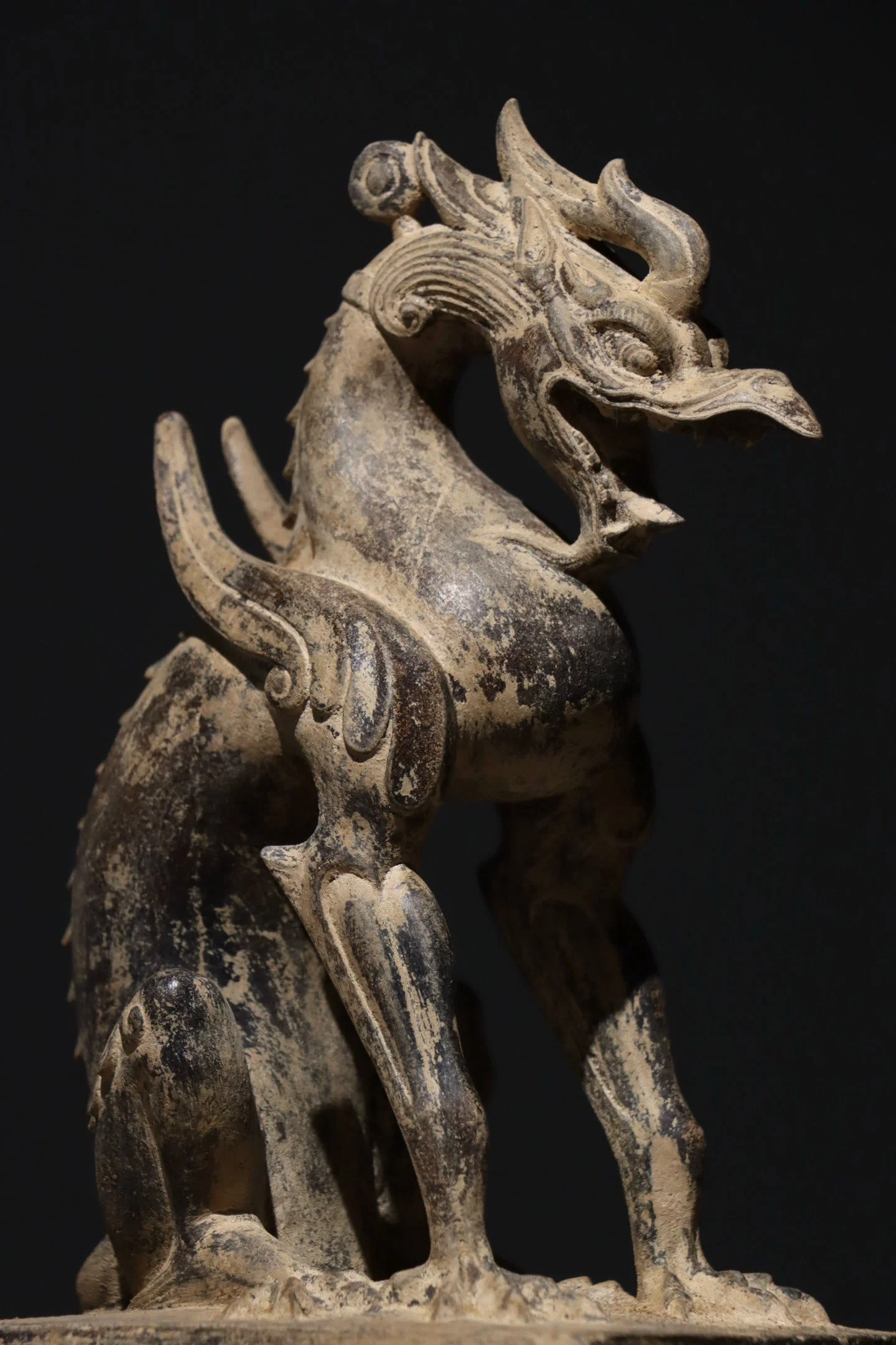 A BLACK BLUESTONE MYTHICAL BEAST