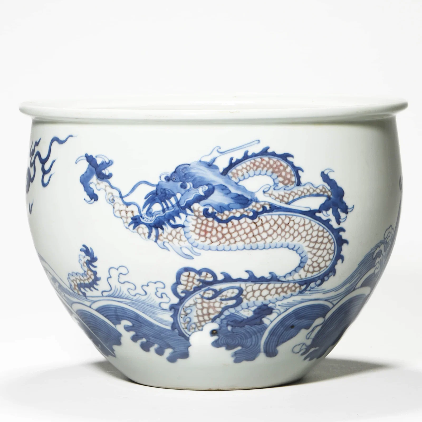 A BLUE AND WHITE AND UNDERGLAZE-RED DRAGON JAR.
