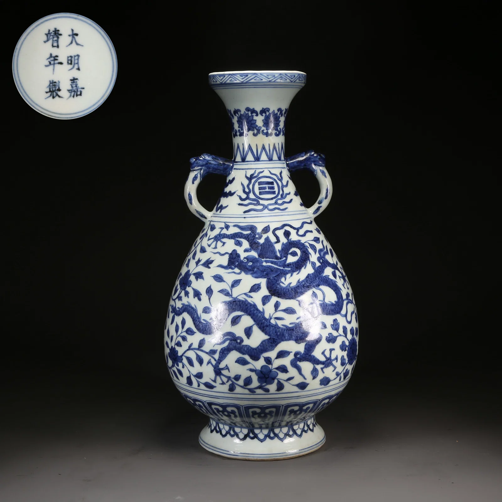 A BLUE-AND-WHITE BEAST-HANDLED DISH-MOUTH VASE WITH DRAGON AMONG FLOWERS MOTIF