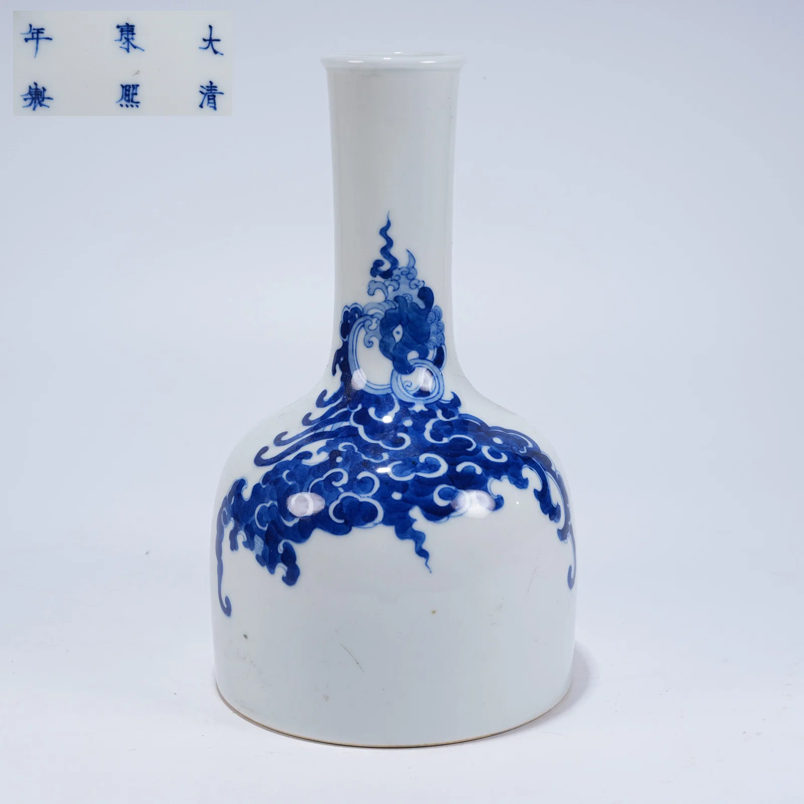 A BLUE-AND-WHITE BELL-SHAPED ZUN WITH SEA BEAST MOTIFS