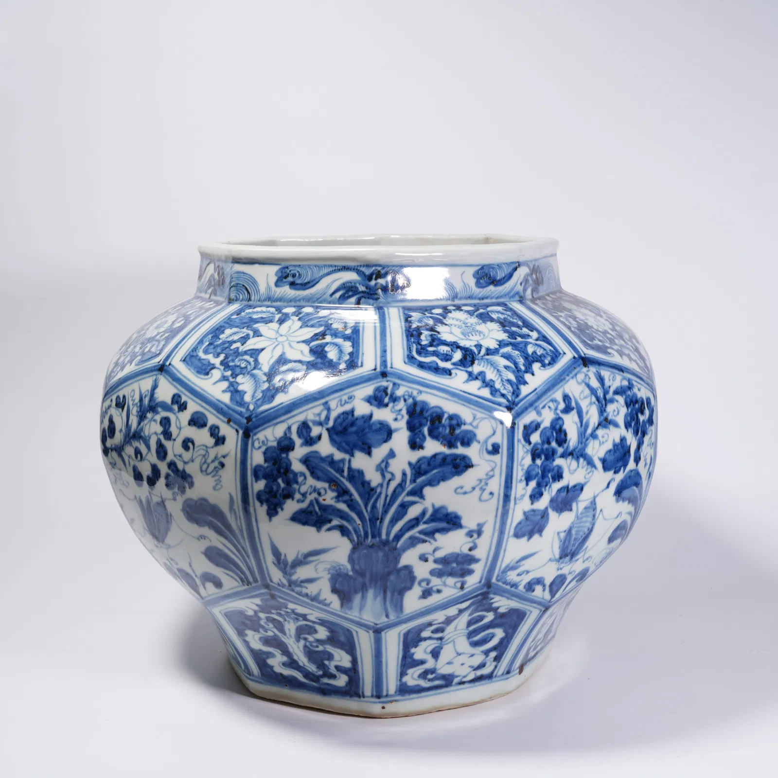 A BLUE-AND-WHITE FLOWER-AND-BIRD MOTIF JAR