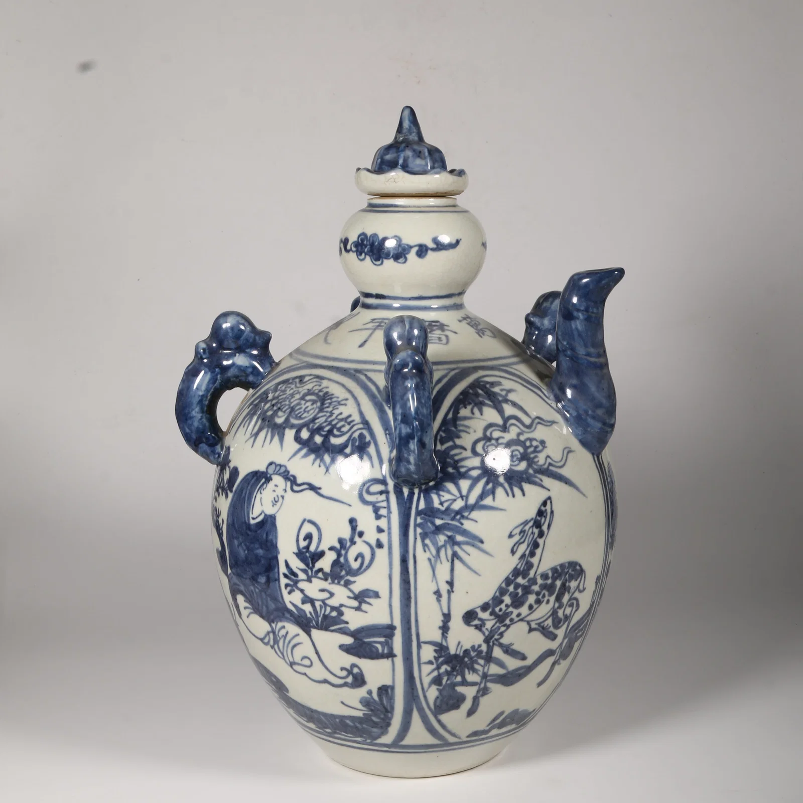 A BLUE-AND-WHITE FOUR-AFFECTIONS FOUR-HANDLED TEAPOT