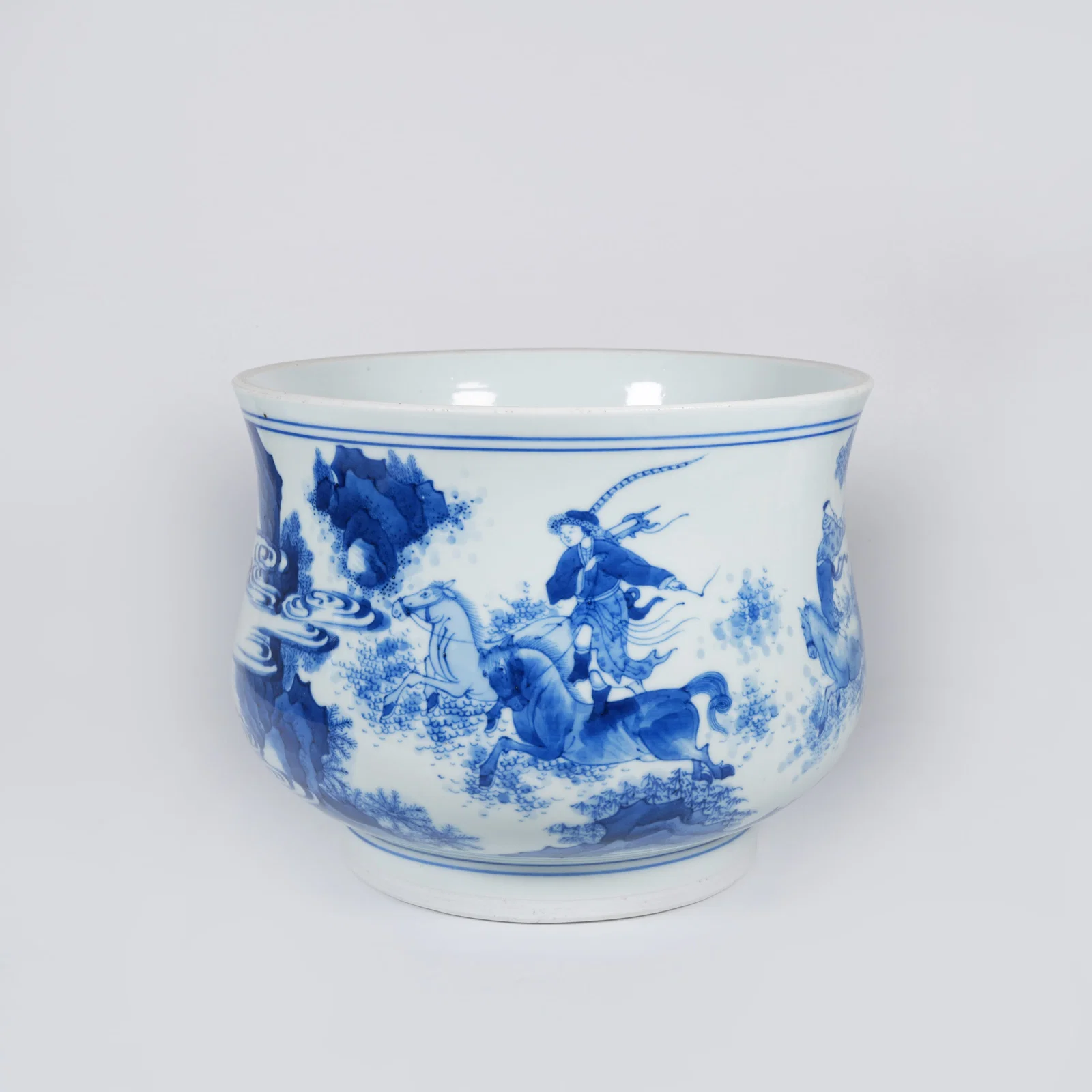 A BLUE-AND-WHITE INCENSE BURNER WITH HORSE-AND-RIDER MOTIF