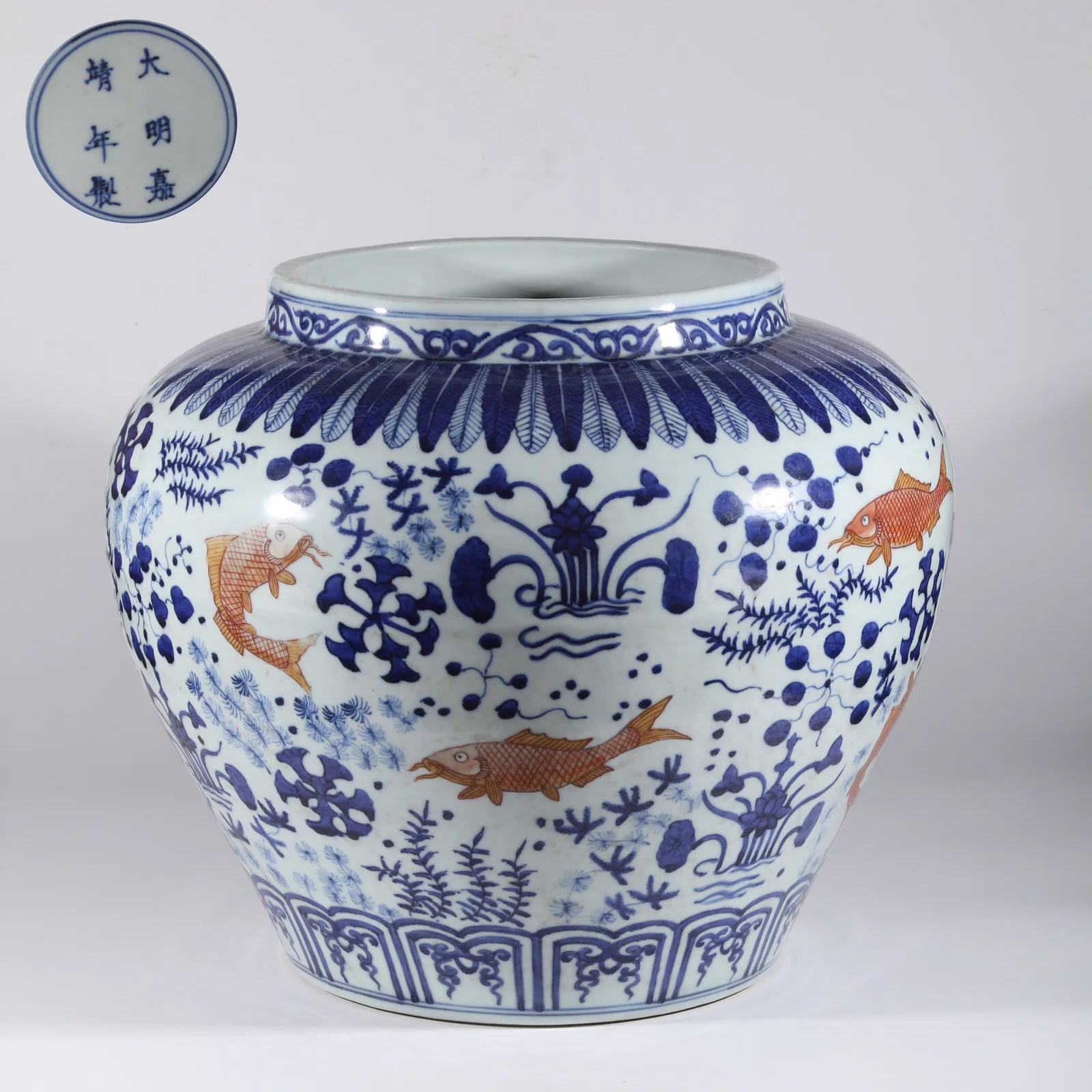A BLUE-AND-WHITE LARGE JAR WITH FAINT RED FISH AND ALGAE MOTIF