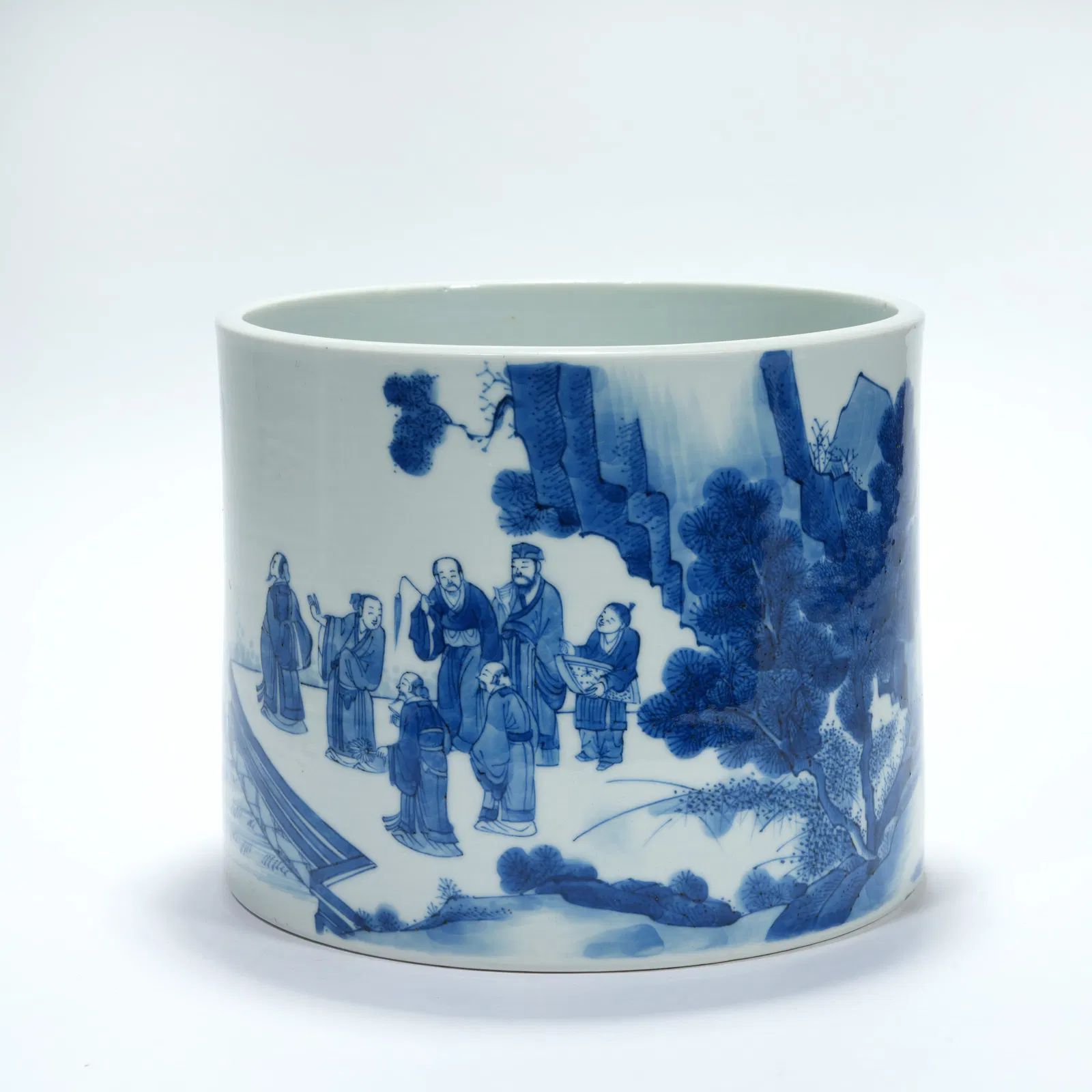 A BLUE-AND-WHITE LITERATI GATHERING MOTIF BRUSH POT