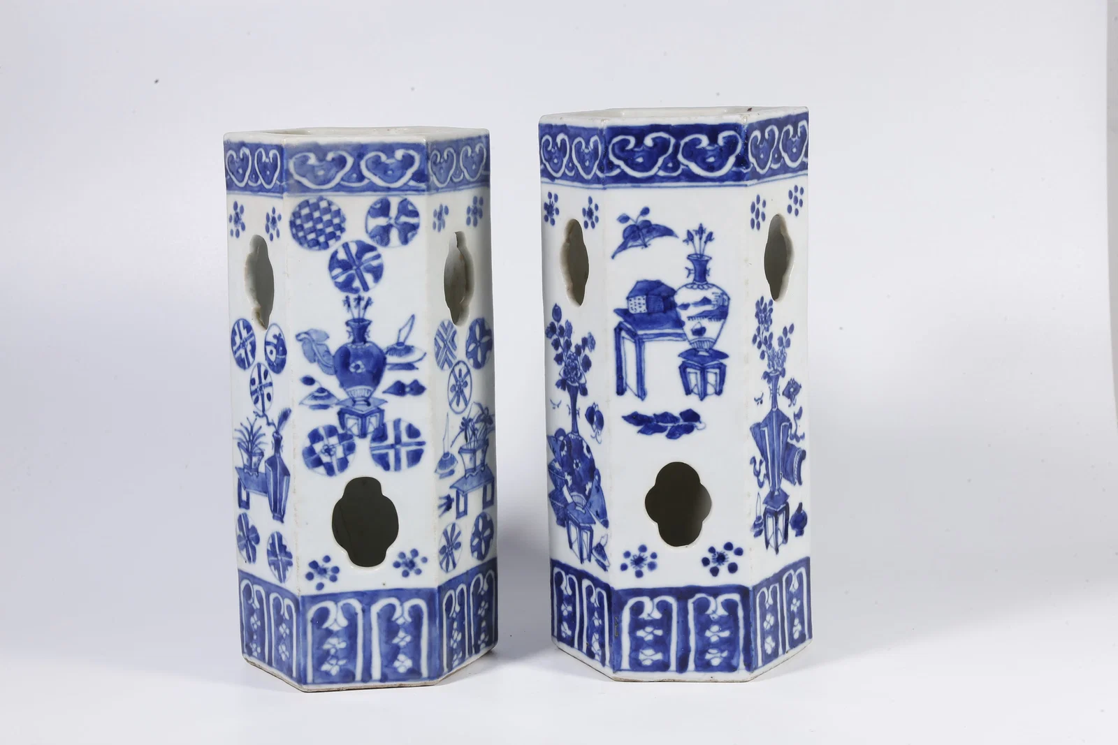A BLUE-AND-WHITE OPENWORK HAT-SHAPED BRUSH HOLDERS WITH FLORAL AND BALL MOTIFS (A PAIR)