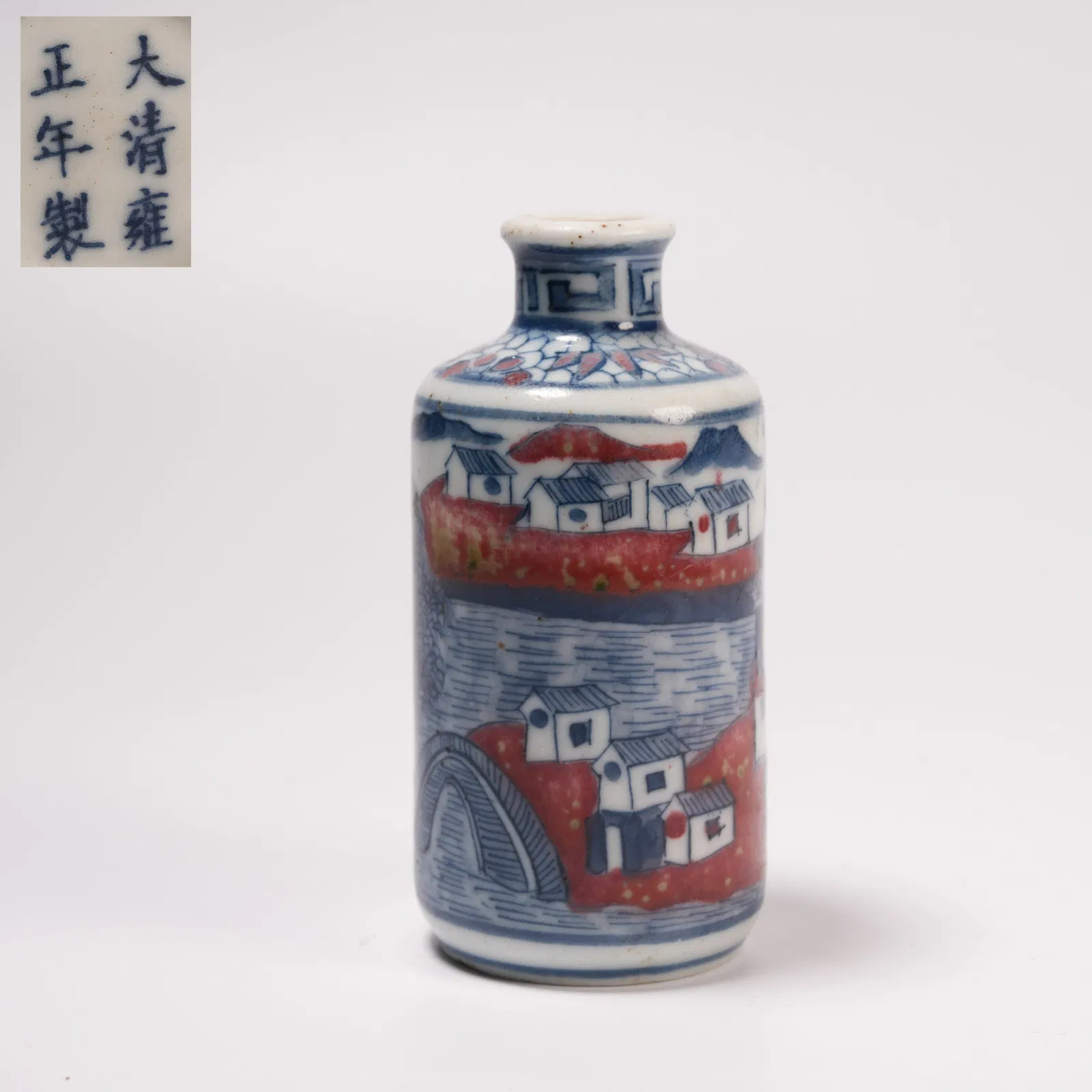 A BLUE-AND-WHITE SNUFF BOTTLE WITH LANDSCAPE MOTIF