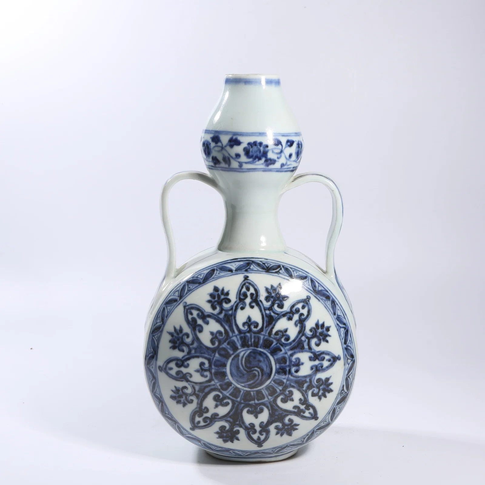 A BLUE-AND-WHITE TREASURE-FLOWER PATTERNED RIBBON-HANDLED MOON FLASK