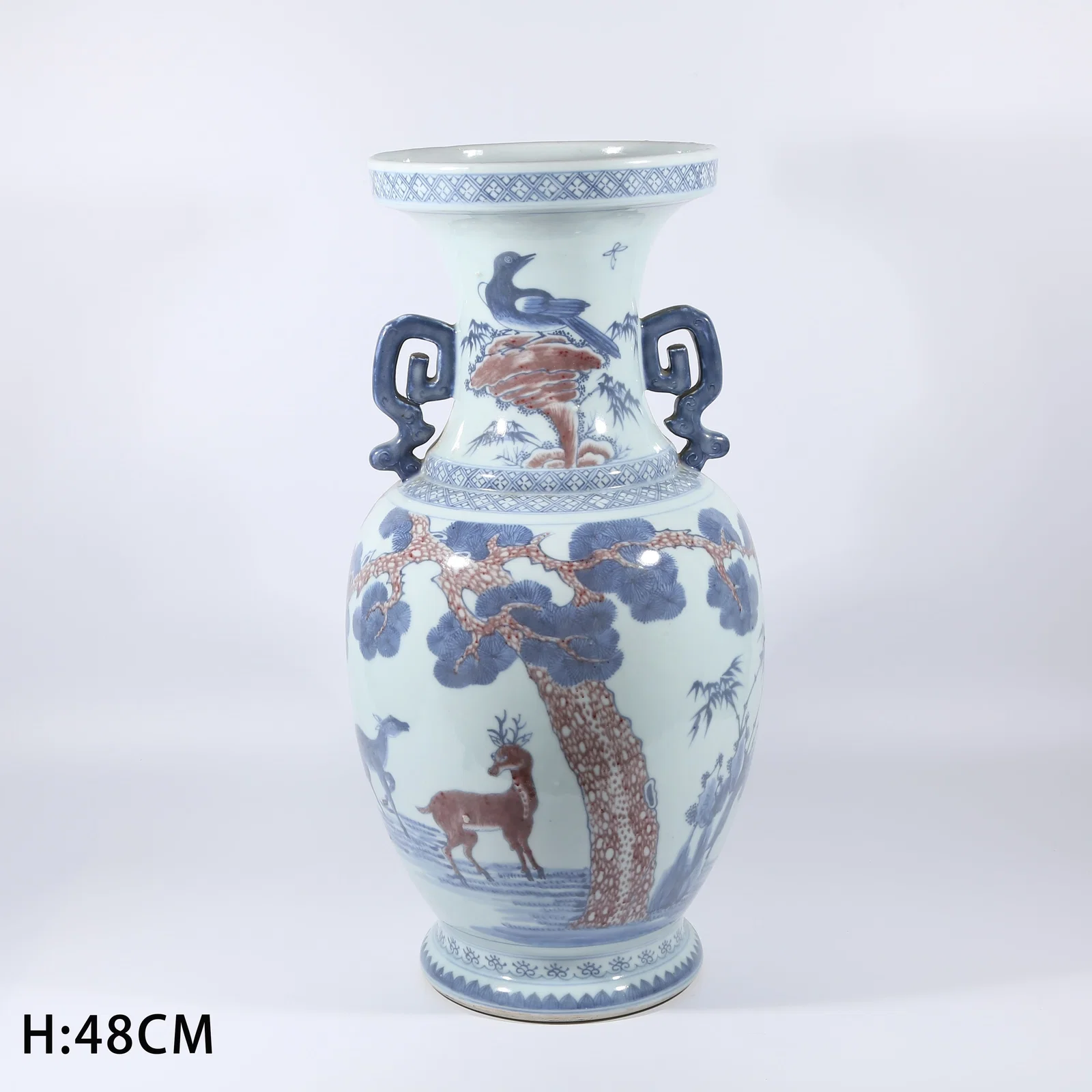 A BLUE AND WHITE WITH UNDERGLAZE RED VASE WITH PINE-AND-DEER DESIGN AND EVERTED RIM