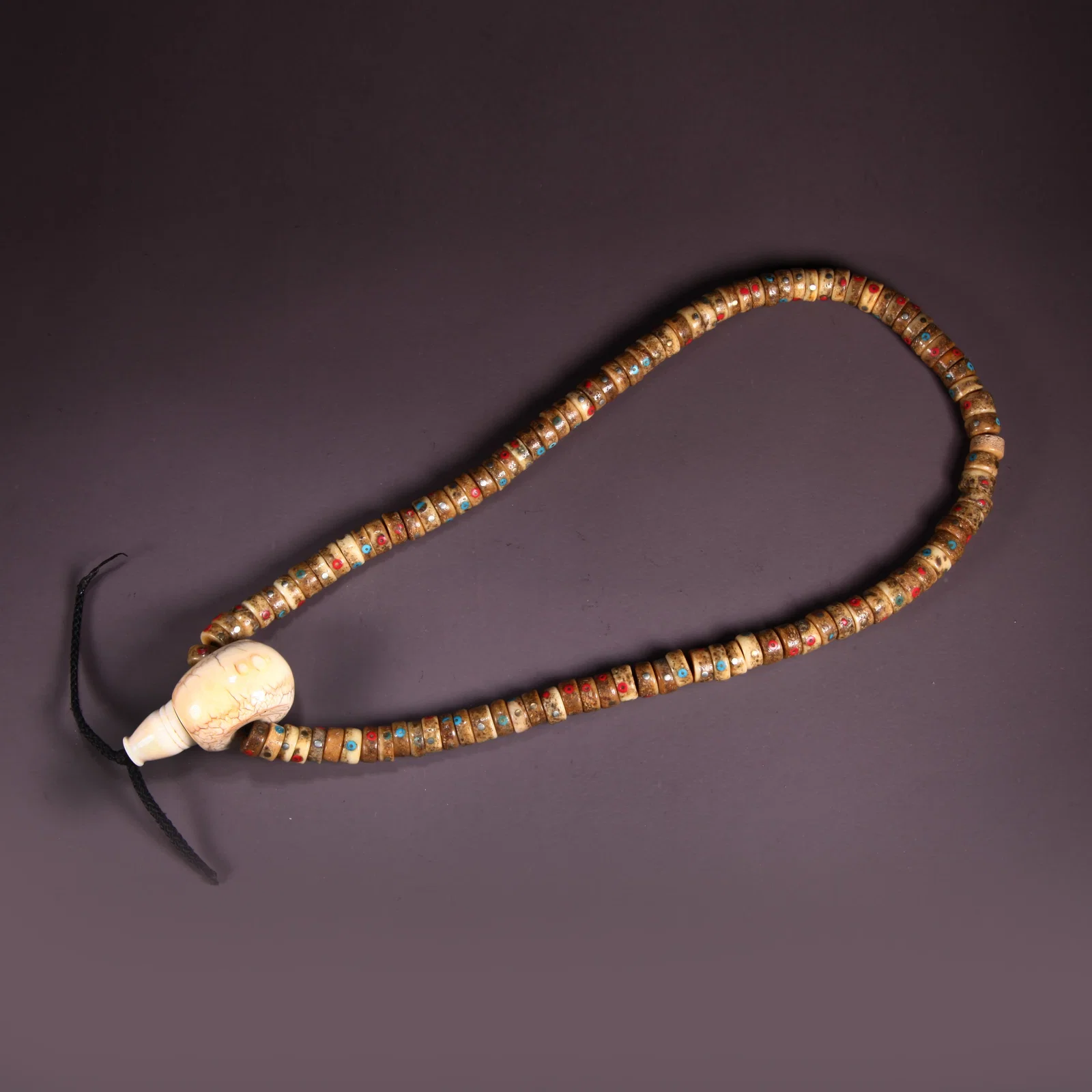 A BONE GABALA (HAND-HELD)