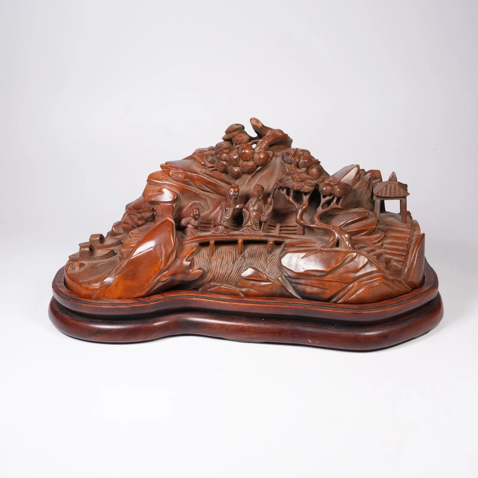 A BOXWOOD MINIATURE ORNAMENT DEPICTING FRIENDS VISITING