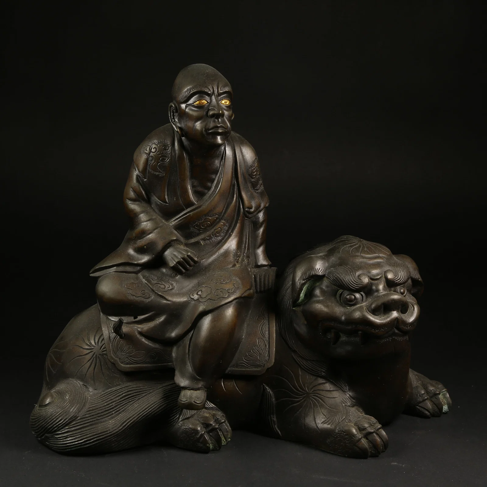 A BRONZE ARHAT STATUE