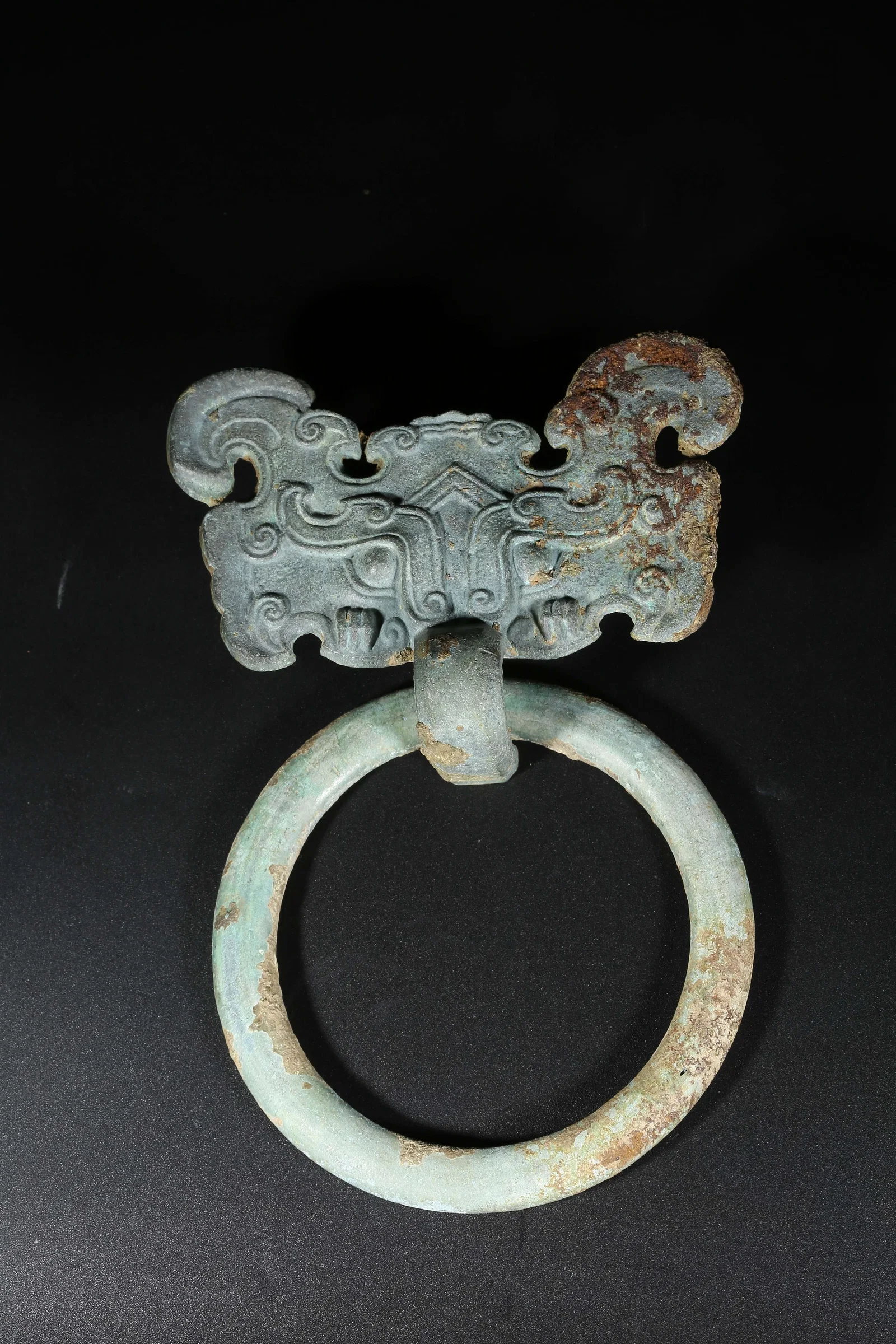 A BRONZE BEAST-FACE FITTINGS