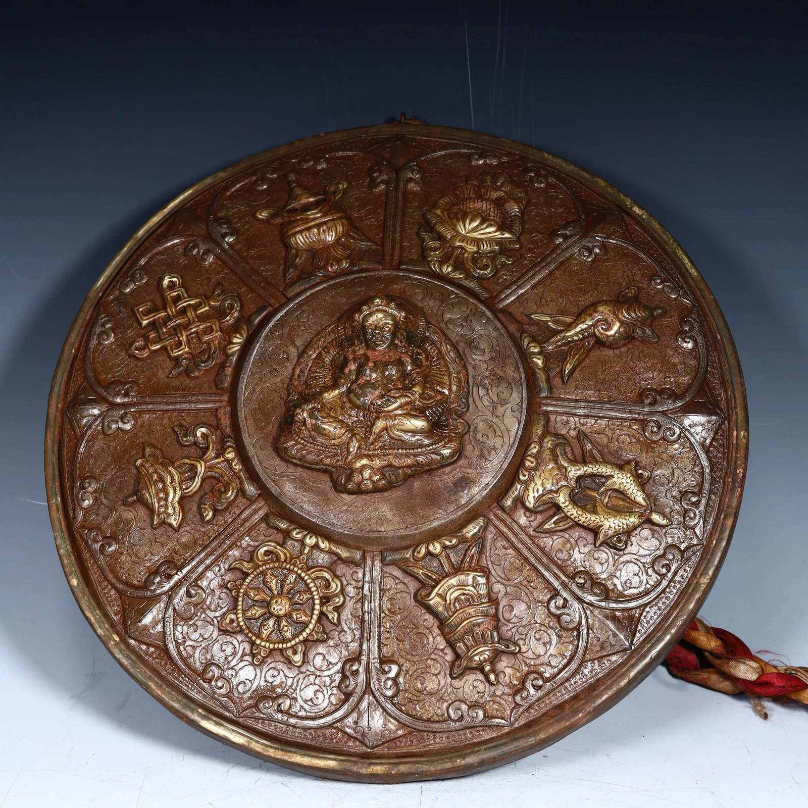 A bronze Buddhist eight-treasure shield in the Qing Dynasty