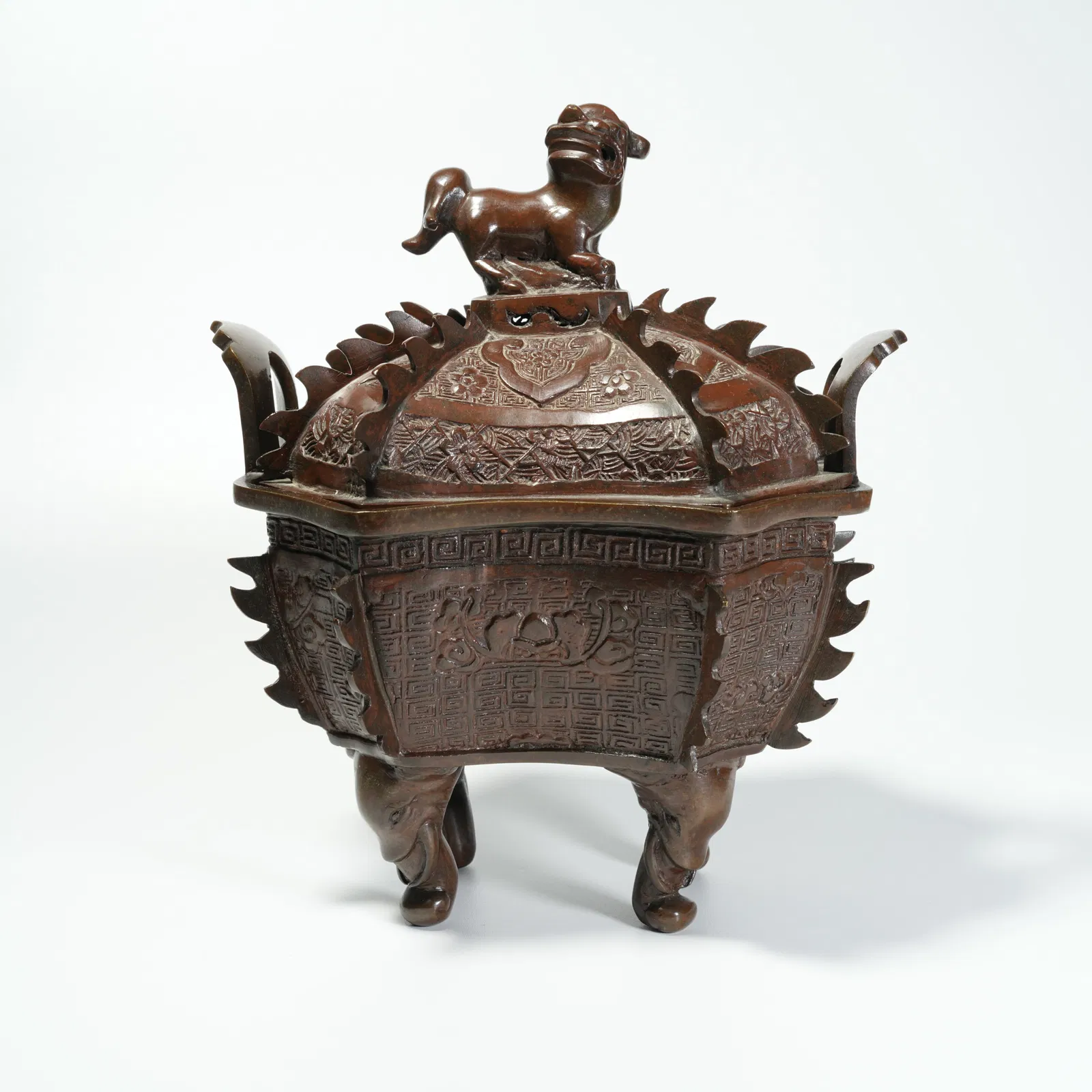 A BRONZE CENSER WITH LION FINIAL